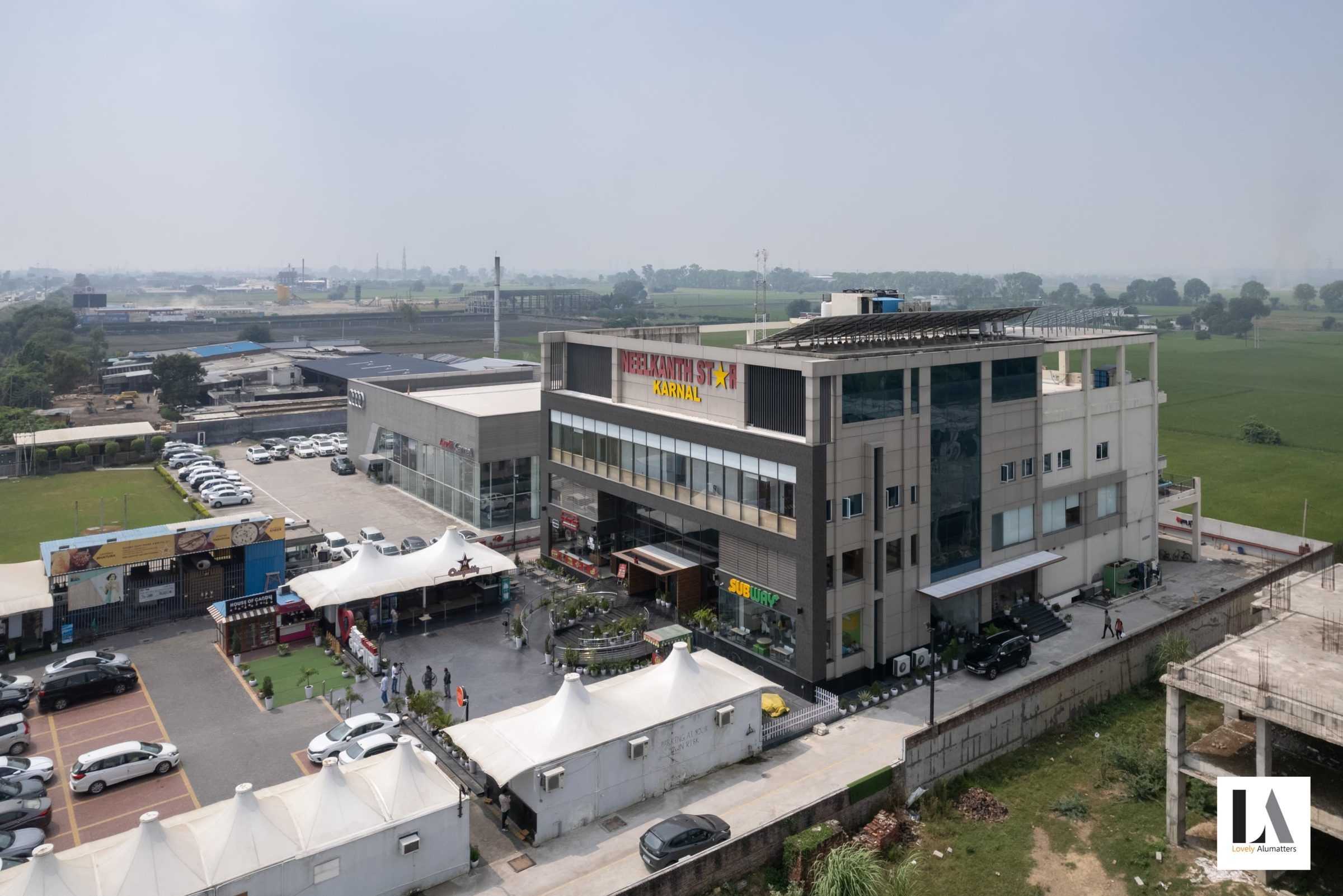Aerial view of a multi-storey hospitality and retail destination