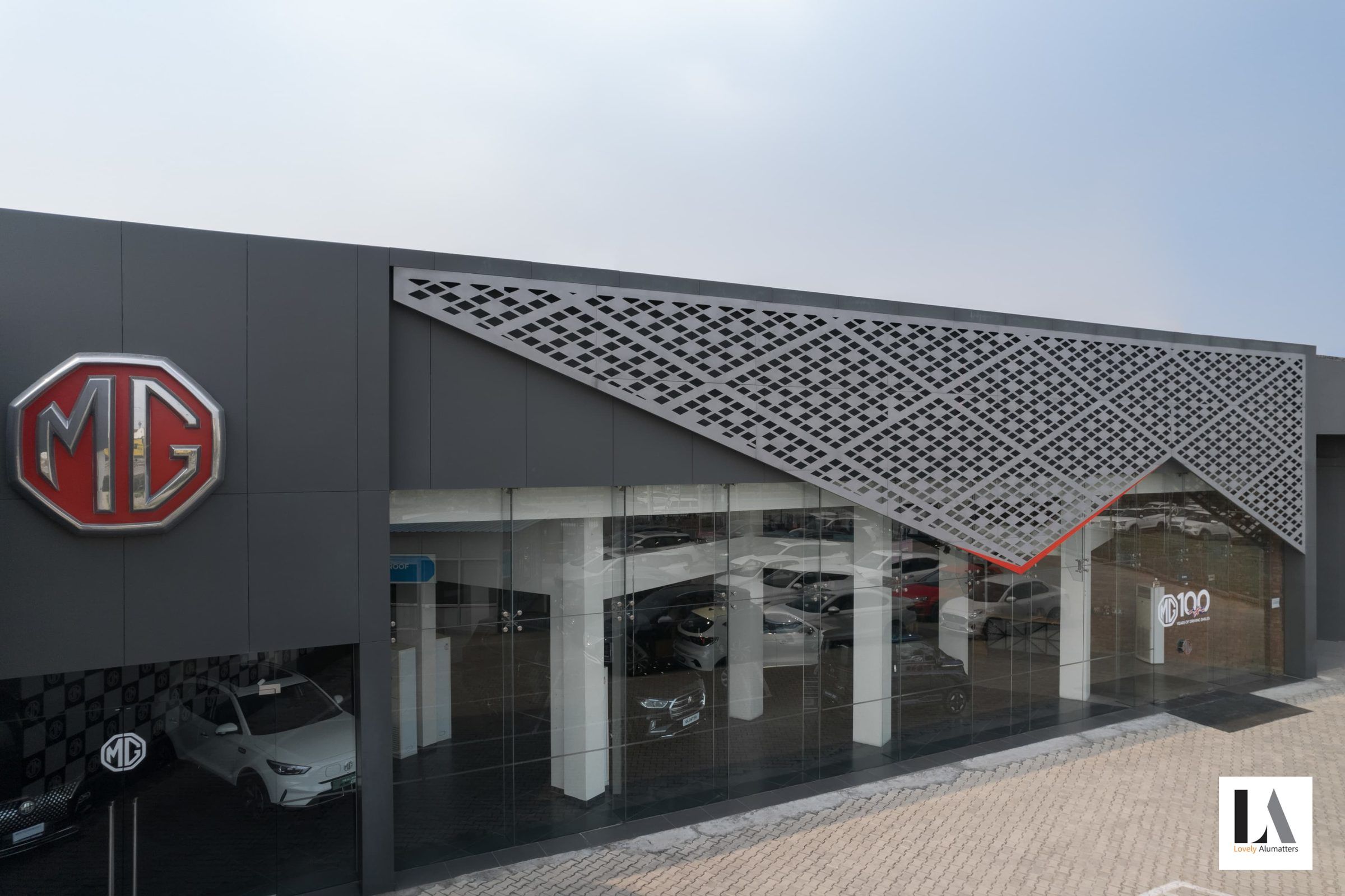 Showroom with a patterned metal canopy over a glass frontage
