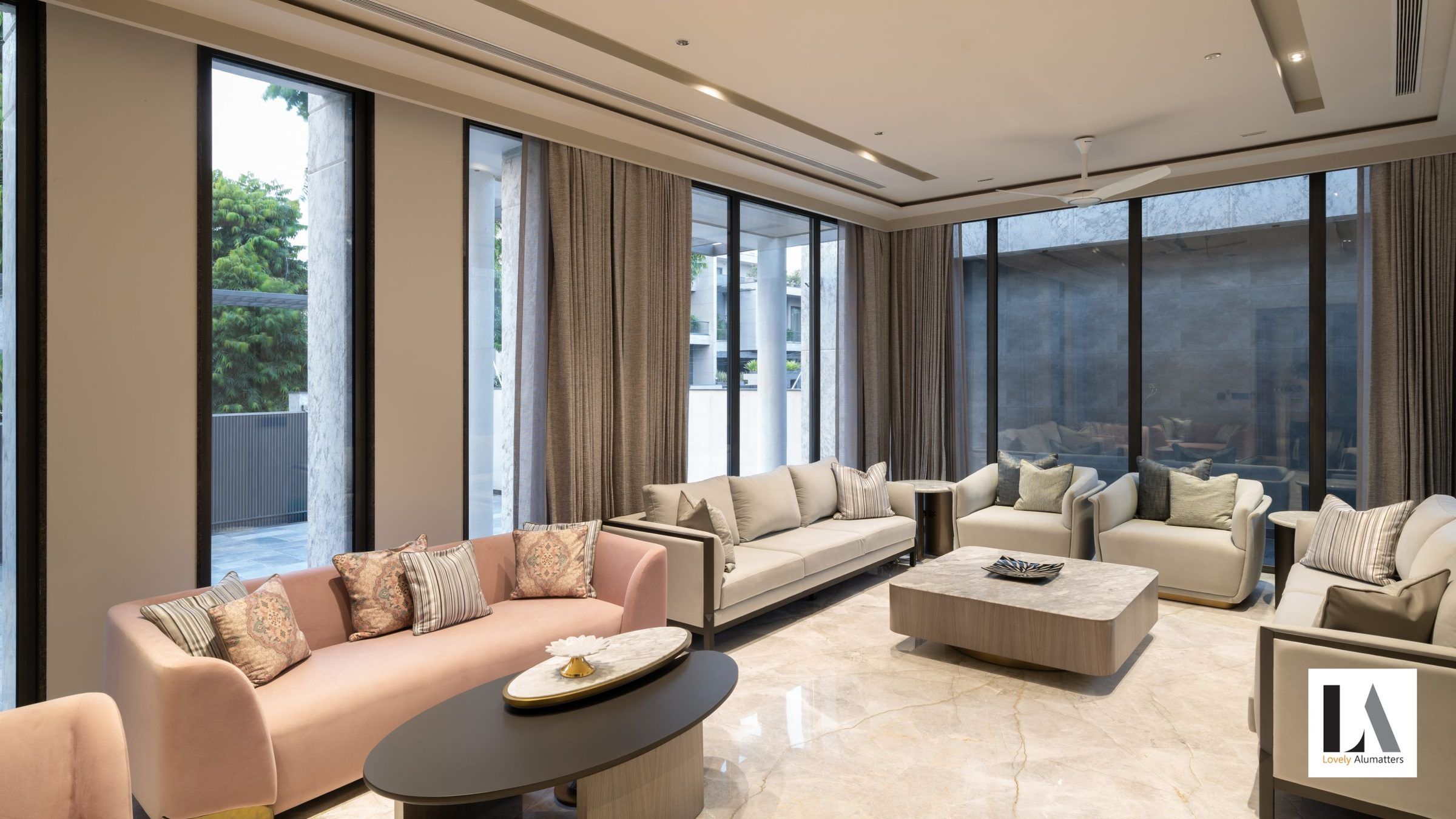 Formal living room lined with floor-to-ceiling windows