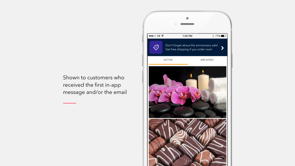 A smartphone displaying a promotional message with images of candles, orchids, and assorted chocolates. The text encourages customers to remember an anniversary sale.