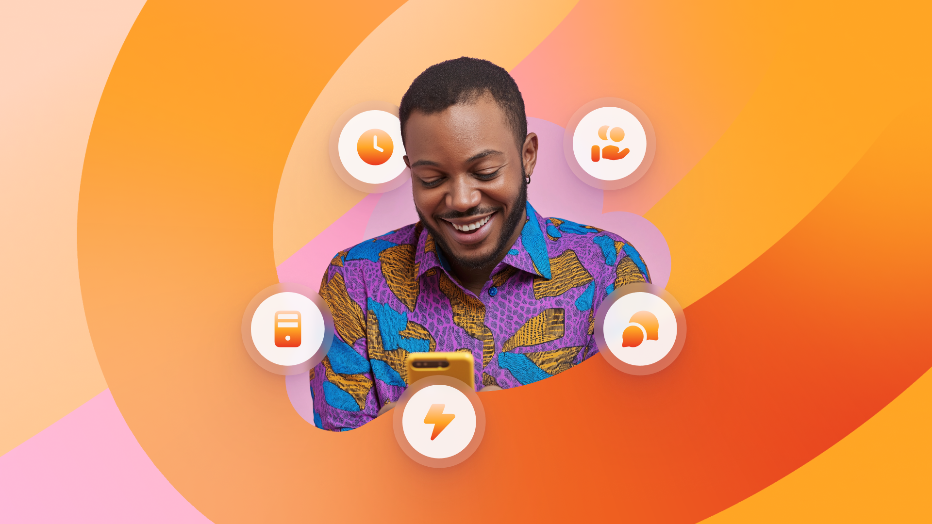 a man in a purple shirt is smiling while looking at his phone