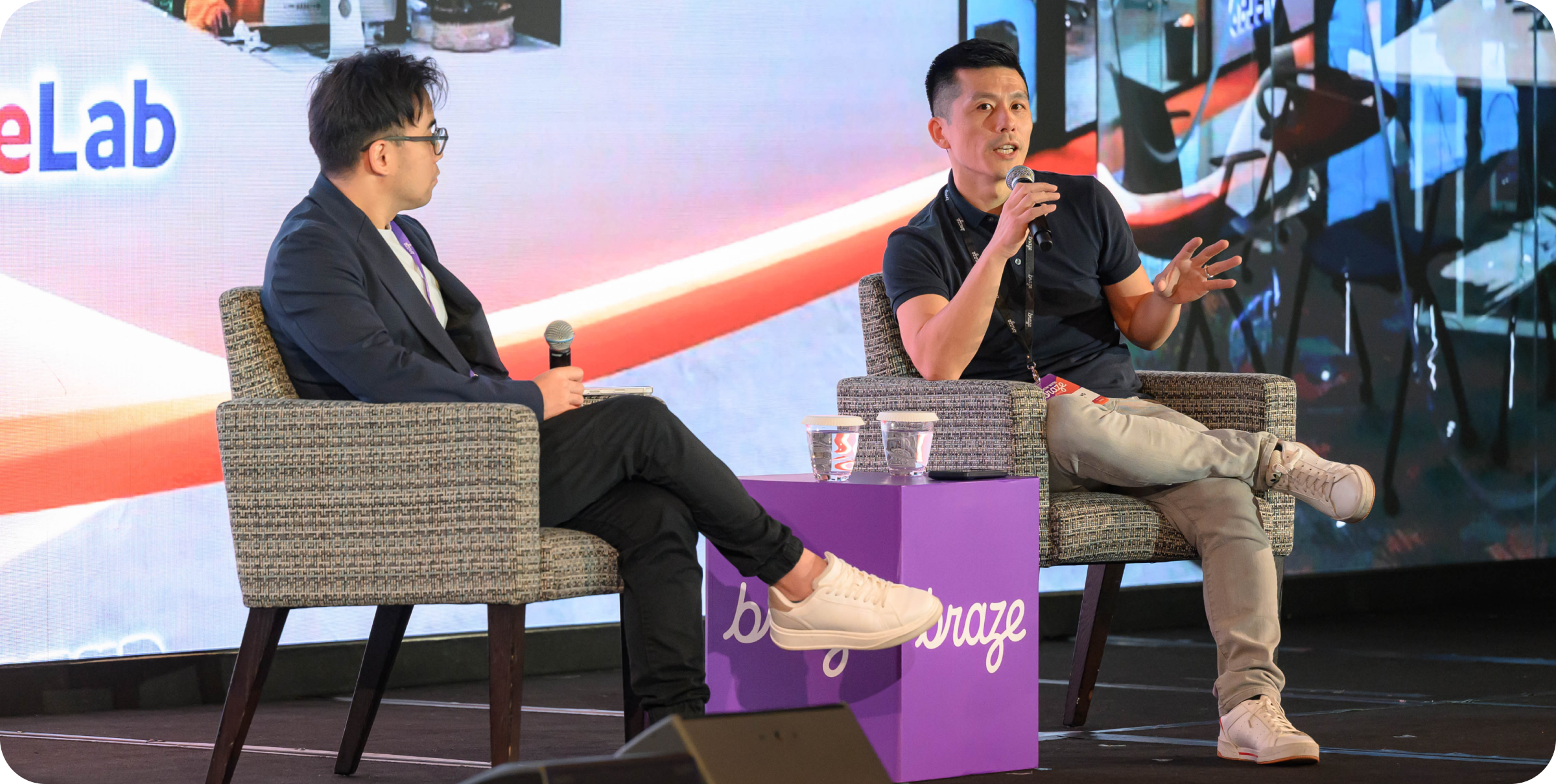 A photo of an onstage fireside chat