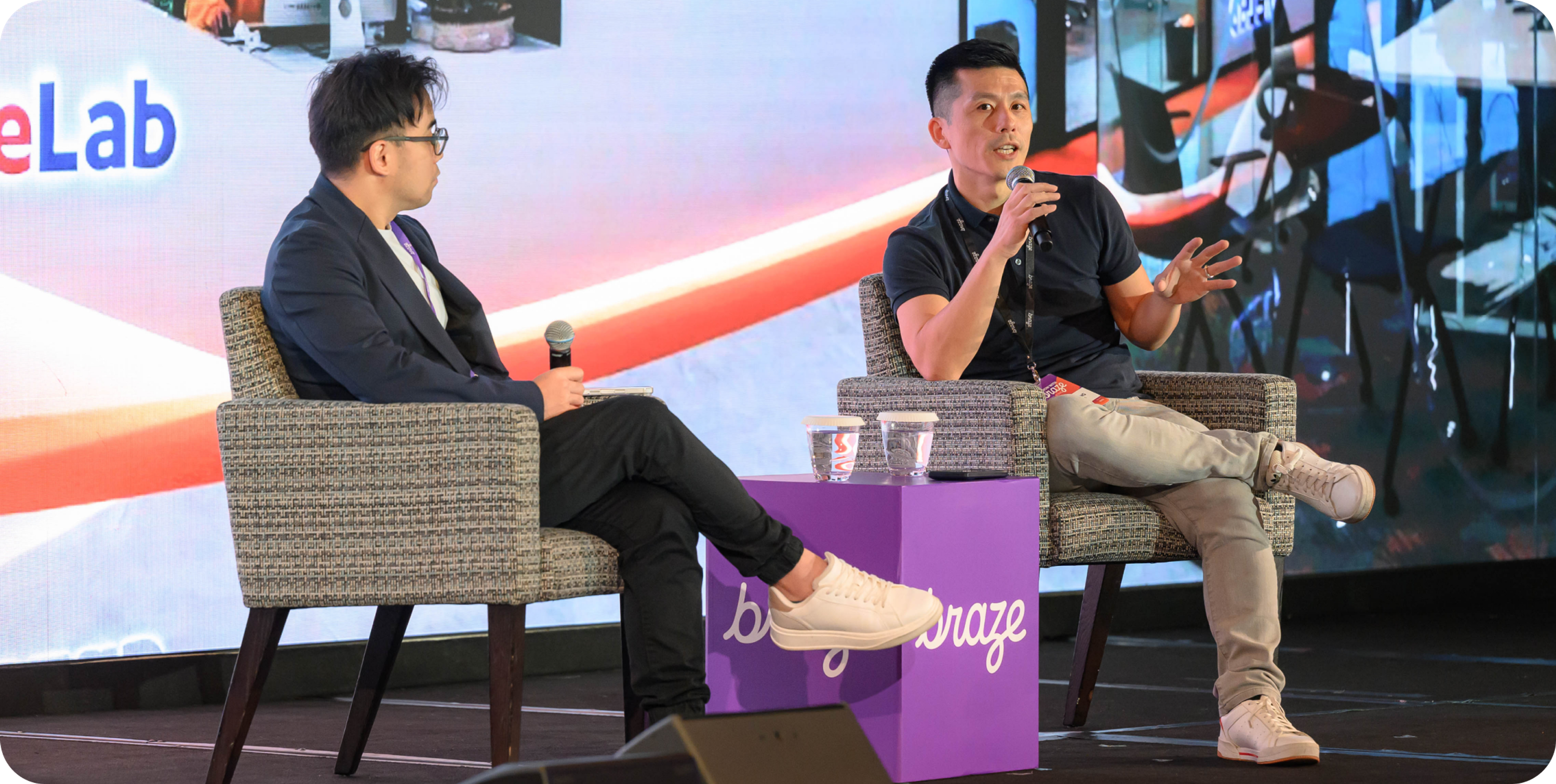 A photo of an onstage fireside chat