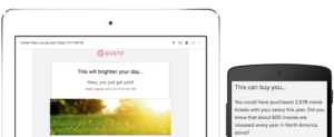An email notification from Gusto on a tablet and smartphone, highlighting that the user has just been paid. The background features a sunny, blurred landscape.