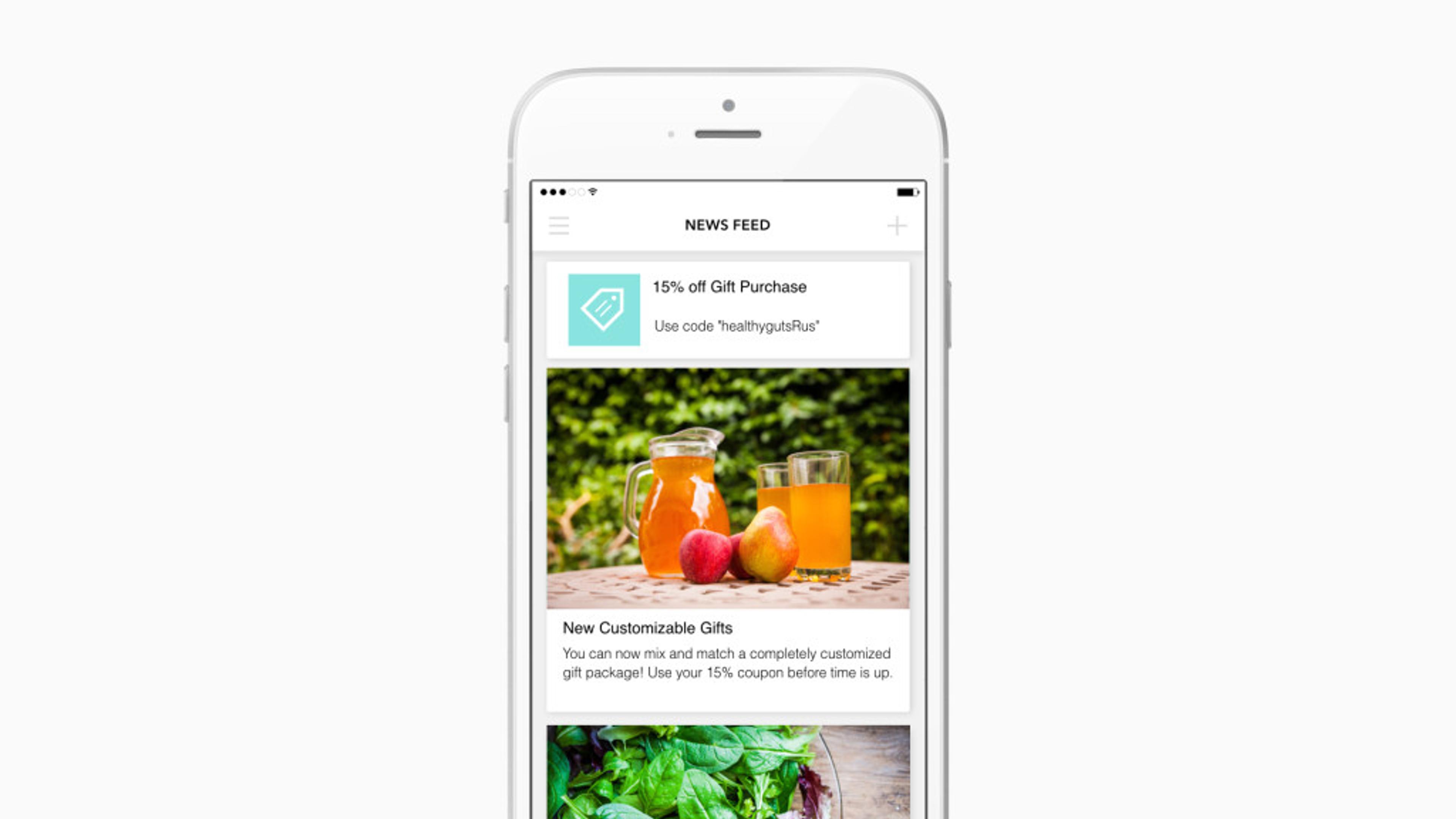 A smartphone displaying a news feed with a promotional offer for 15% off gift purchases and an image of drinks and fruits. Below, there's a section about customizable gifts.