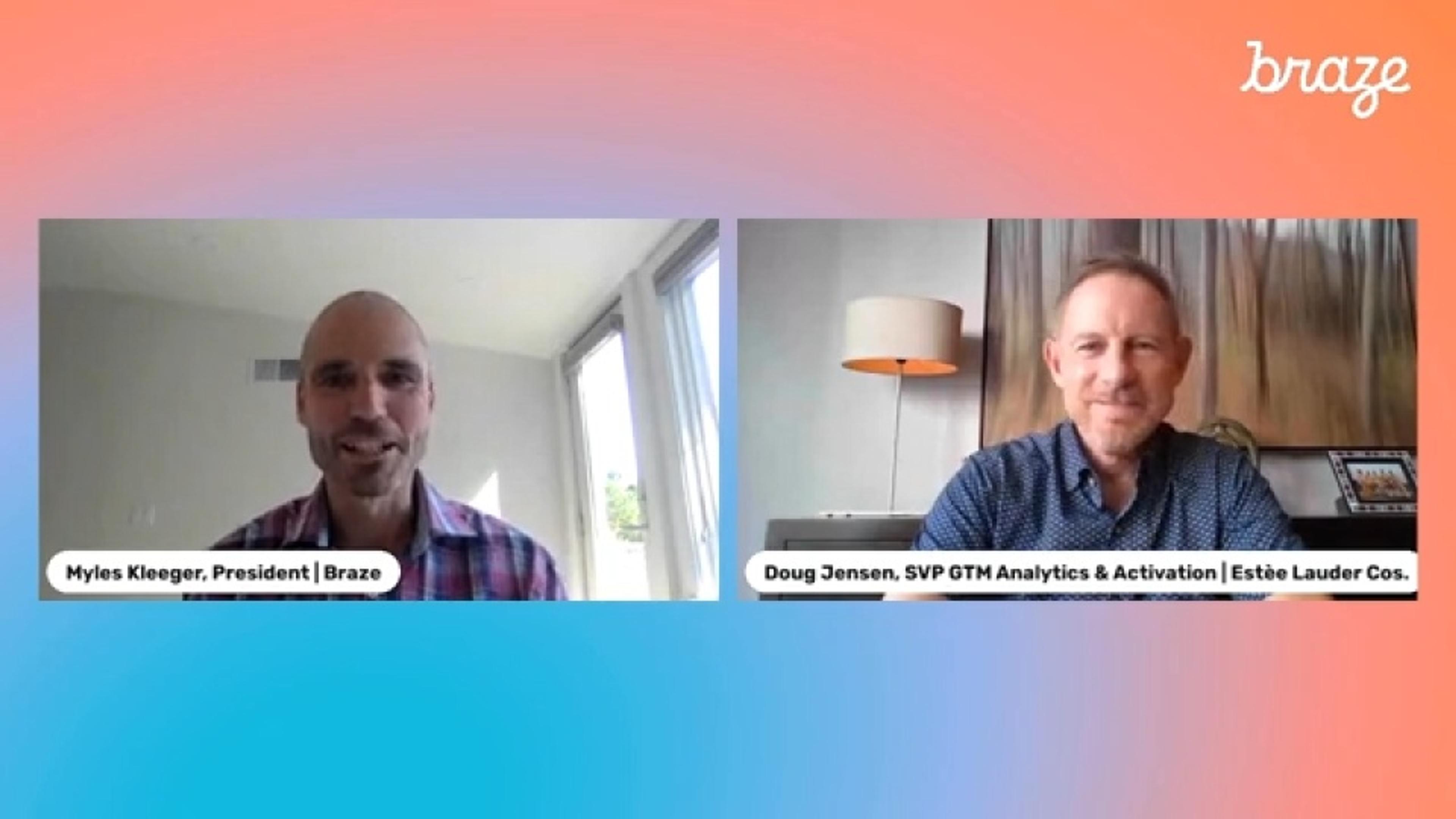 two men are sitting next to each other on a video call .