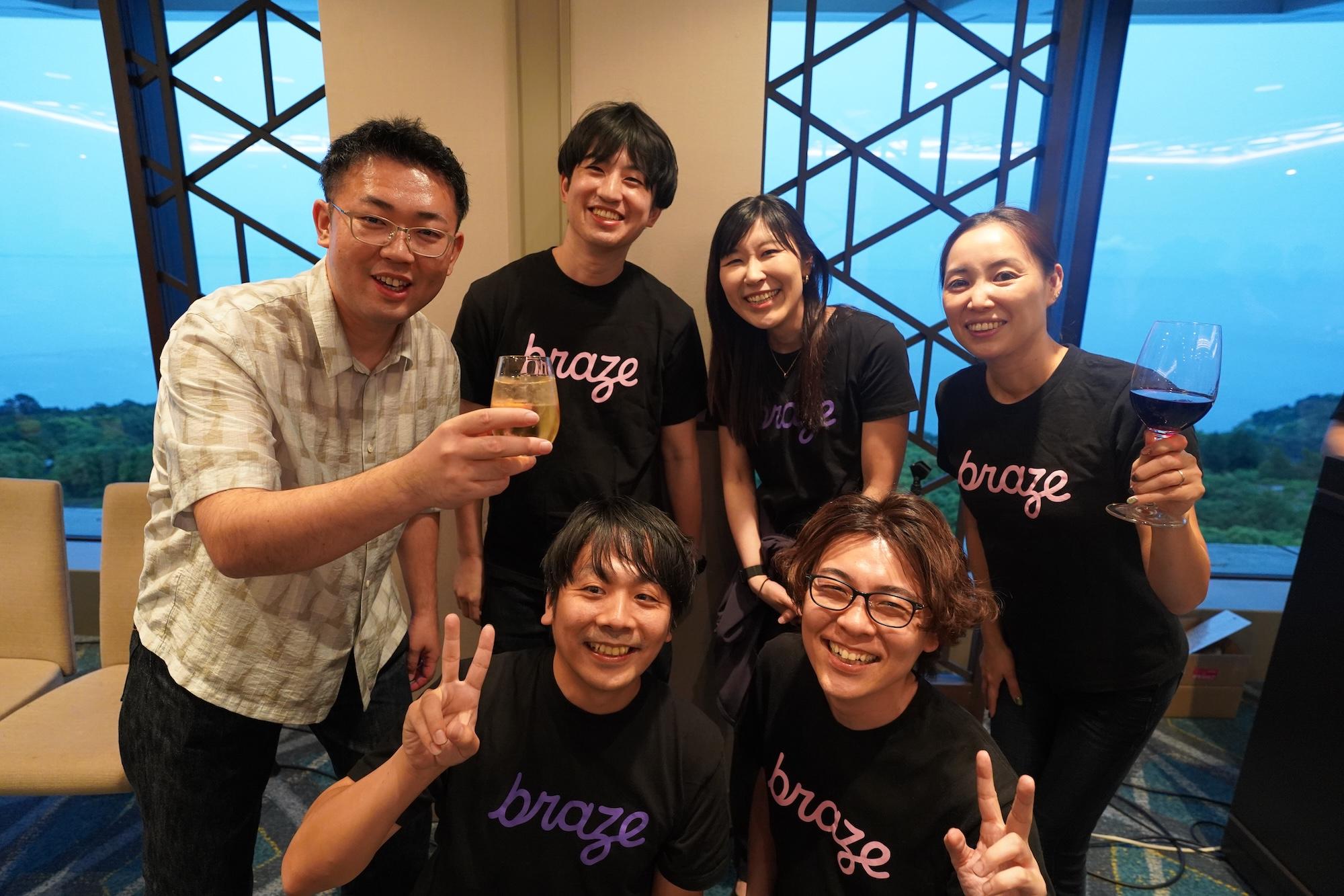 a group of people are posing for a picture in a room .