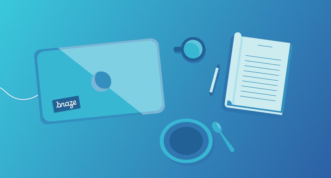 A laptop with a "braze" sticker, a cup of coffee, a notepad, and a pen on a blue background.