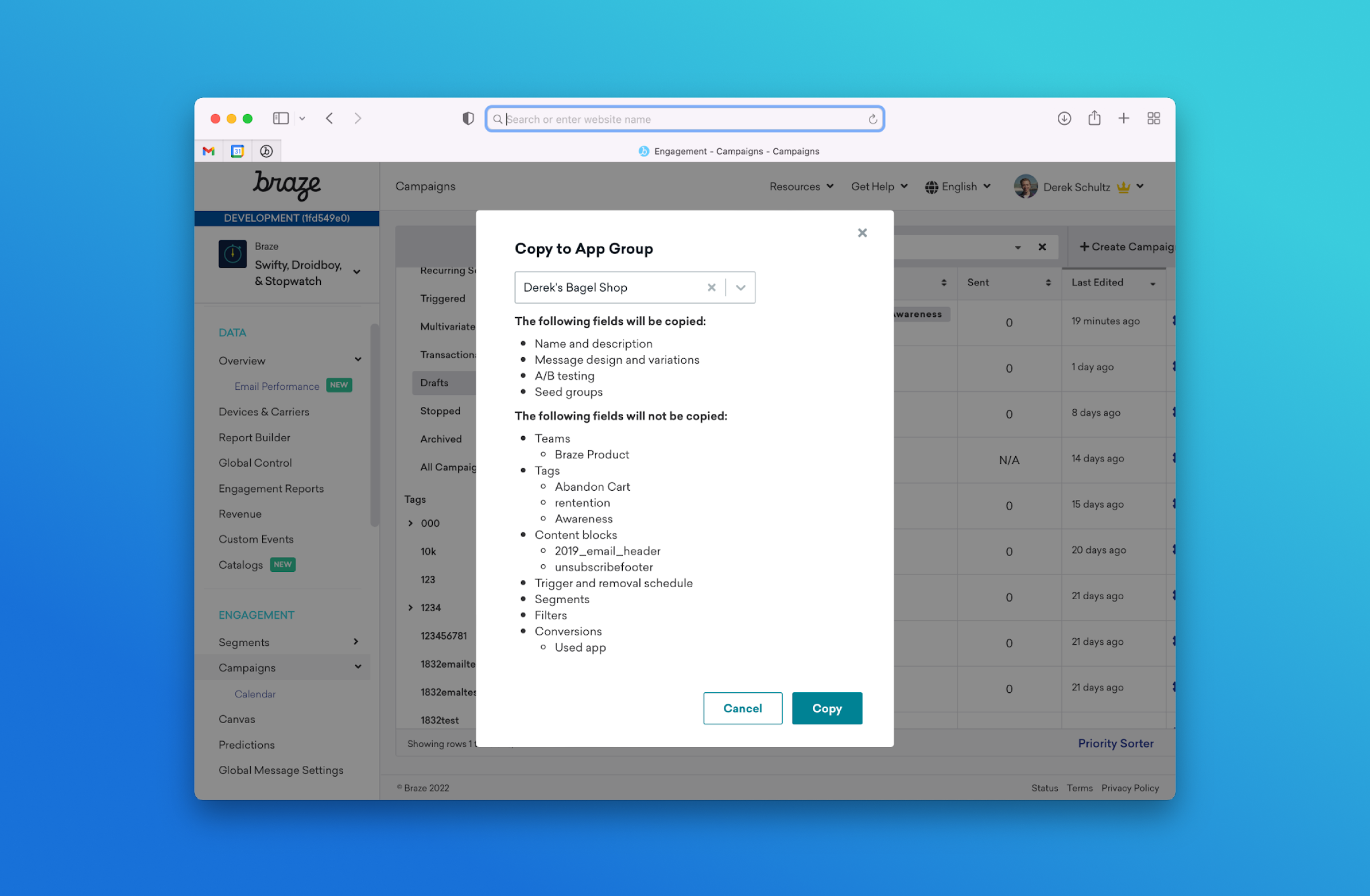 A computer screen displaying a dialog box for copying campaign details in the Braze platform, with a list of items to be copied and not copied. The background features a gradient from blue to teal.