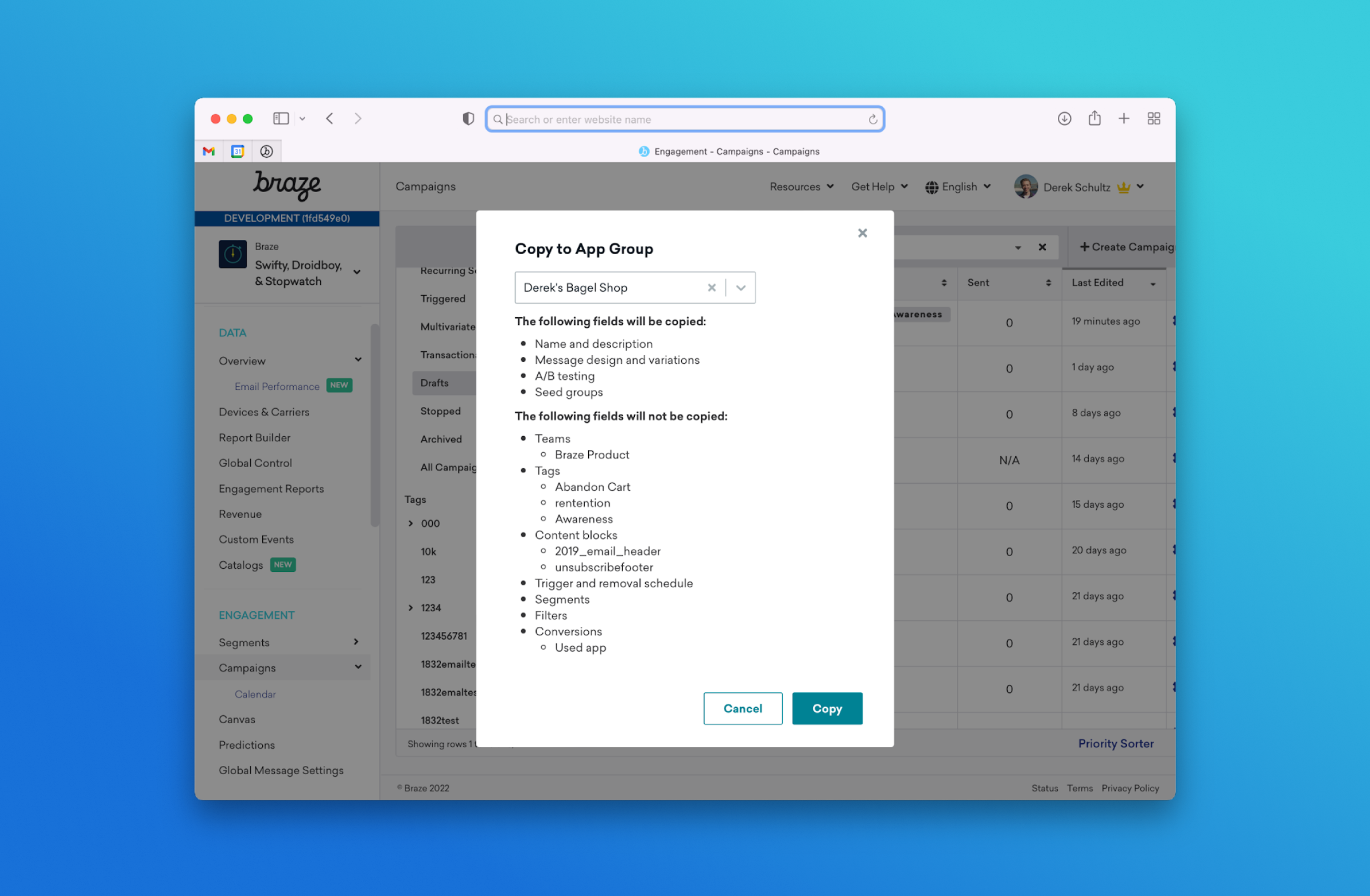 A computer screen displaying a dialog box for copying campaign details in the Braze platform, with a list of items to be copied and not copied. The background features a gradient from blue to teal.