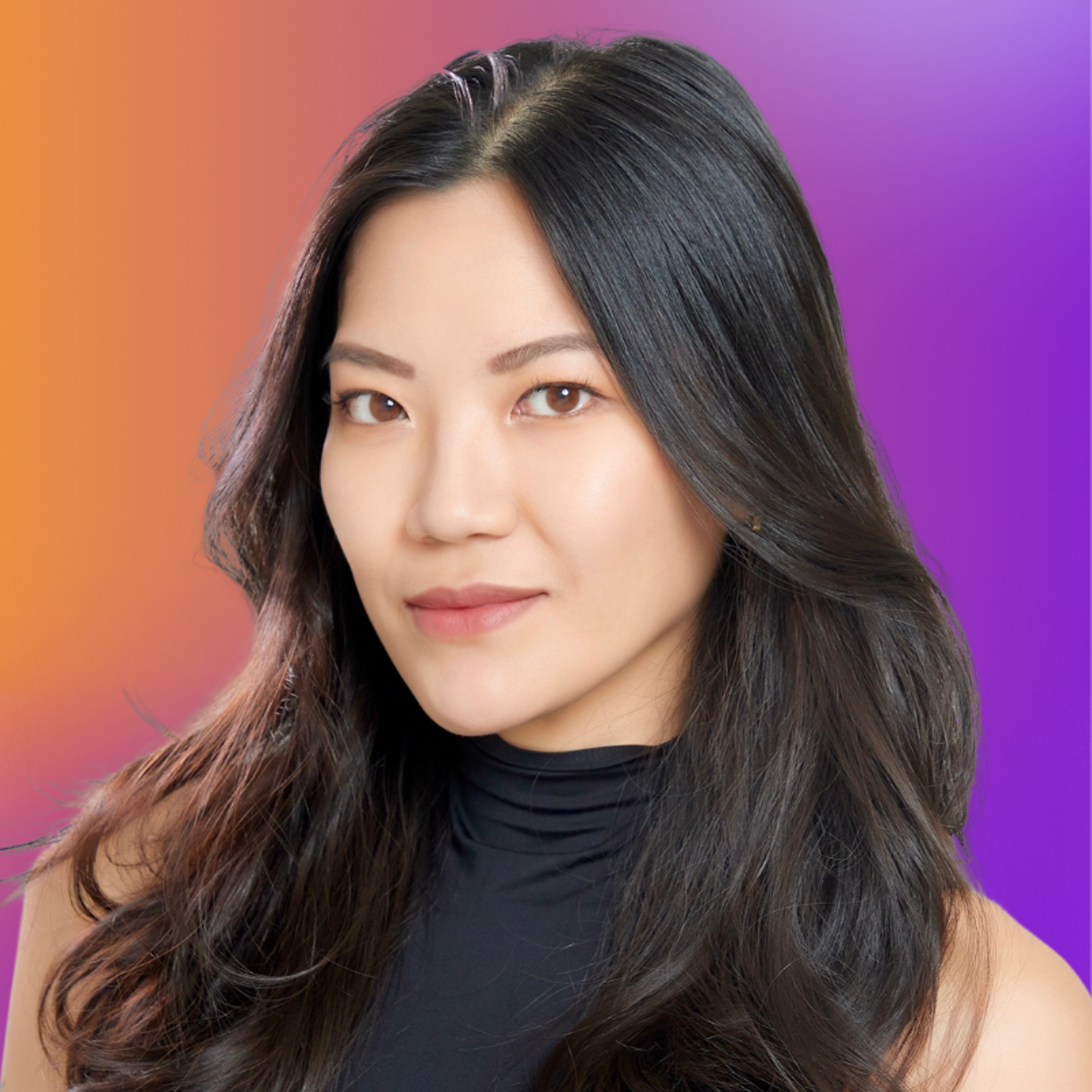 A woman with long, dark hair poses against a gradient background of orange and purple. She wears a black sleeveless top and has a confident expression.