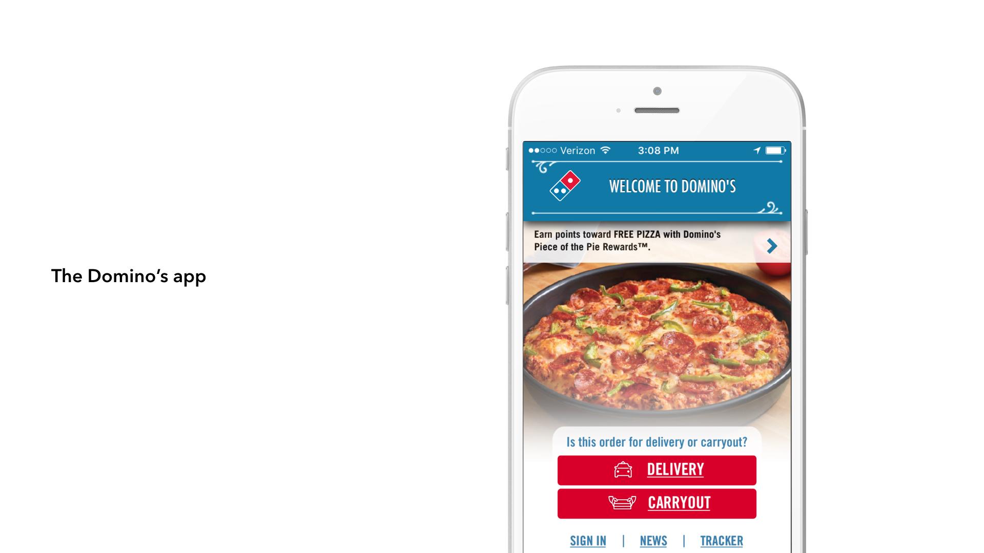A smartphone displaying the Domino's app, featuring a welcome message and options for delivery or carryout. The screen shows a pizza image and promotional text about earning free pizza.