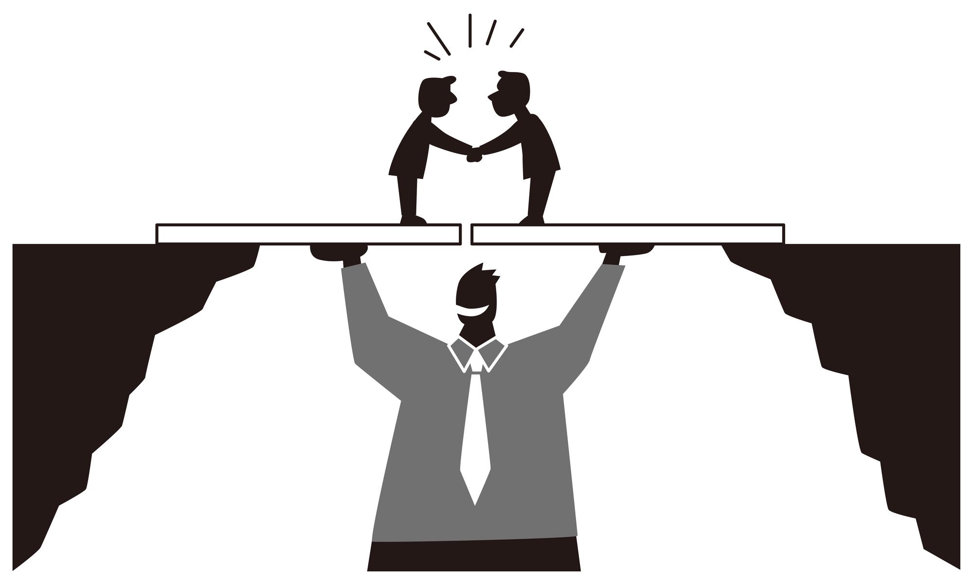 two men are shaking hands over a bridge .