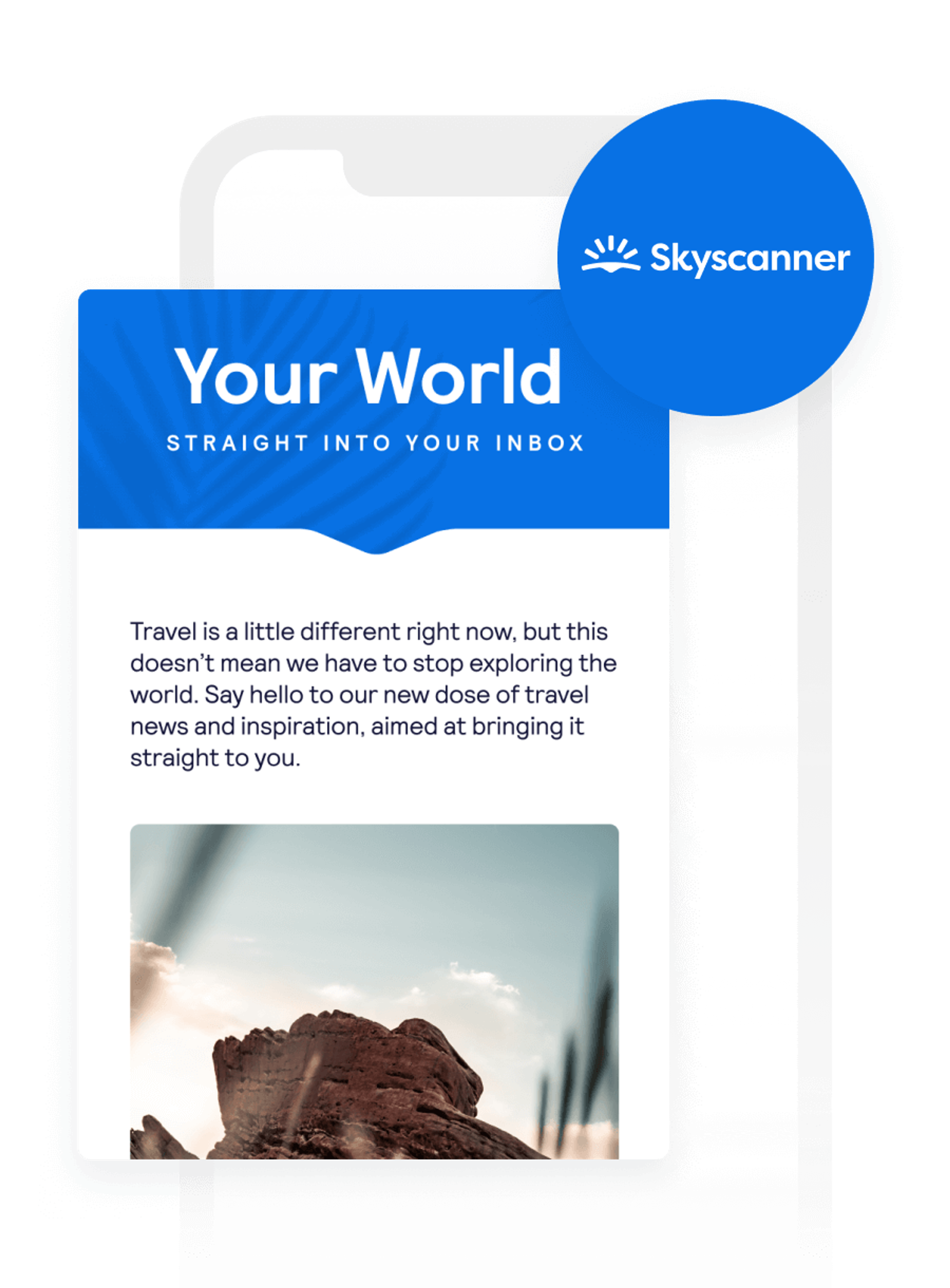 A mobile phone displays a Skyscanner email with the headline "Your World" and a desert landscape photo.