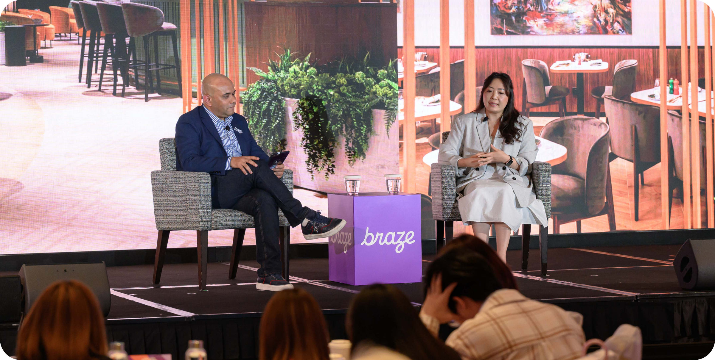 A photo of Manzar Imam and Lydia Chung on stage
