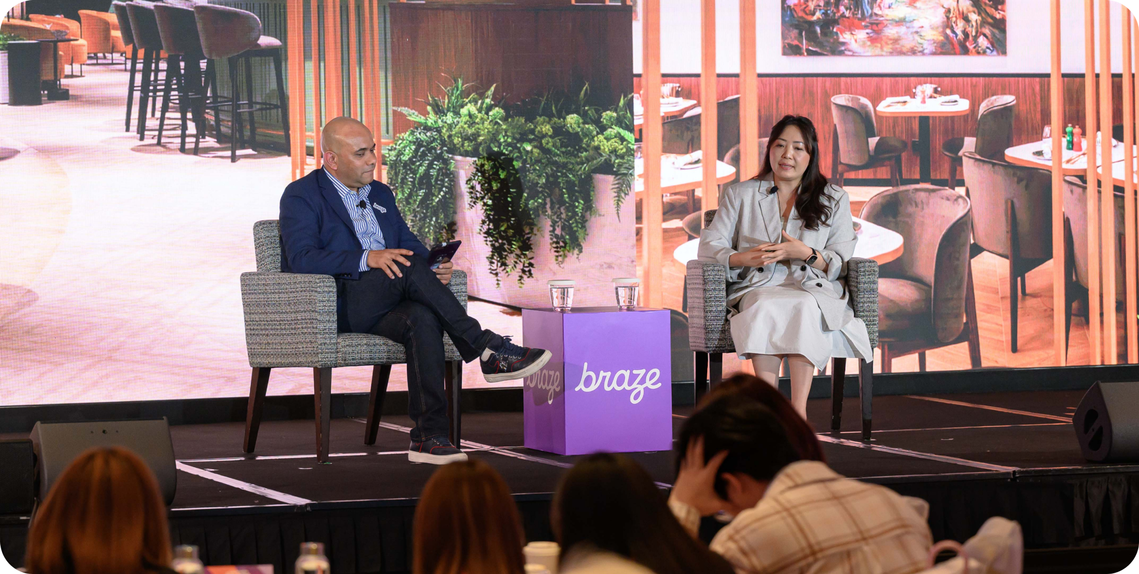 A photo of Manzar Imam and Lydia Chung on stage