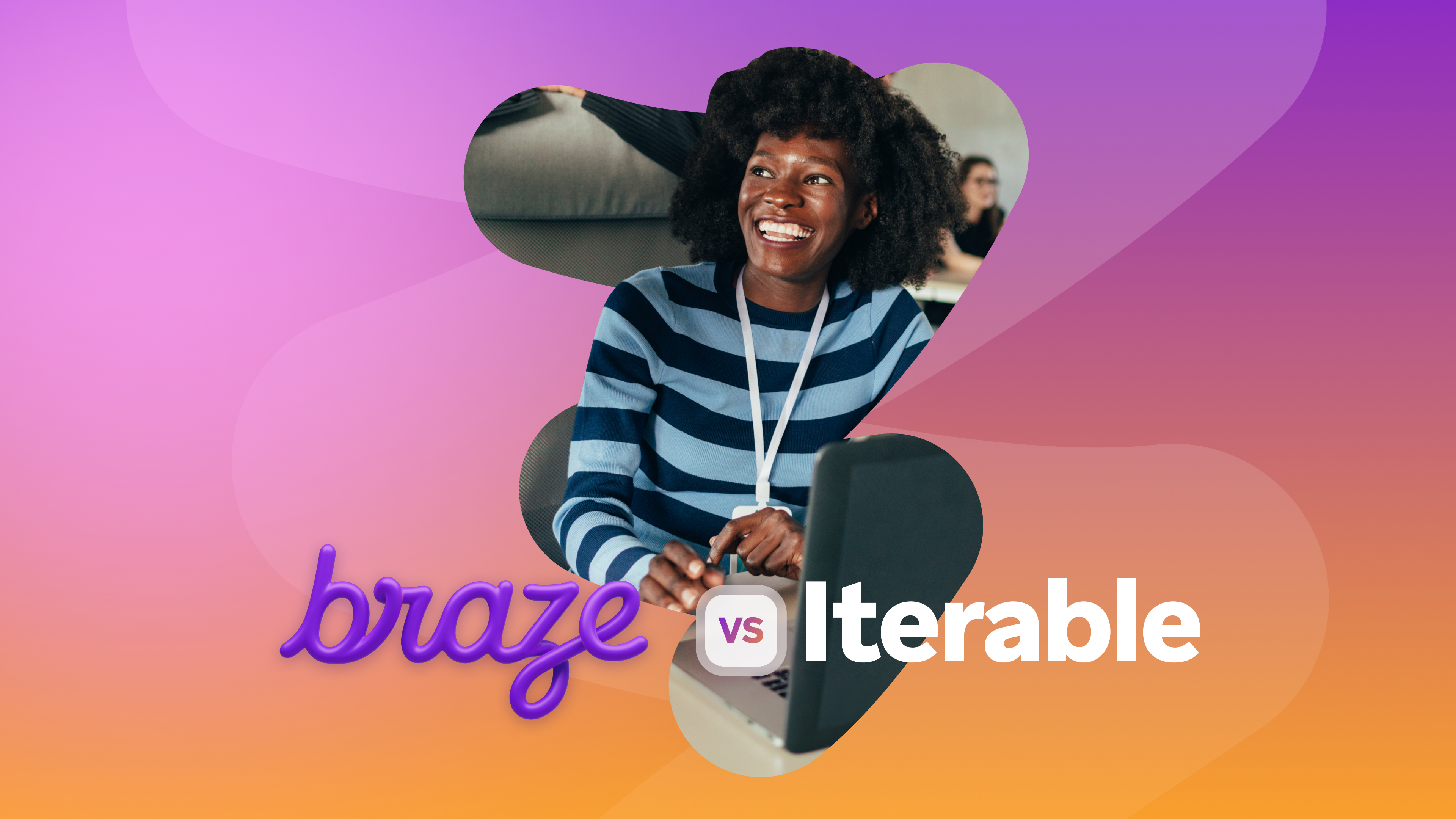 Smiling woman seated at a laptop against a pink, purple, and orange gradient, with the text “Braze vs Iterable.”