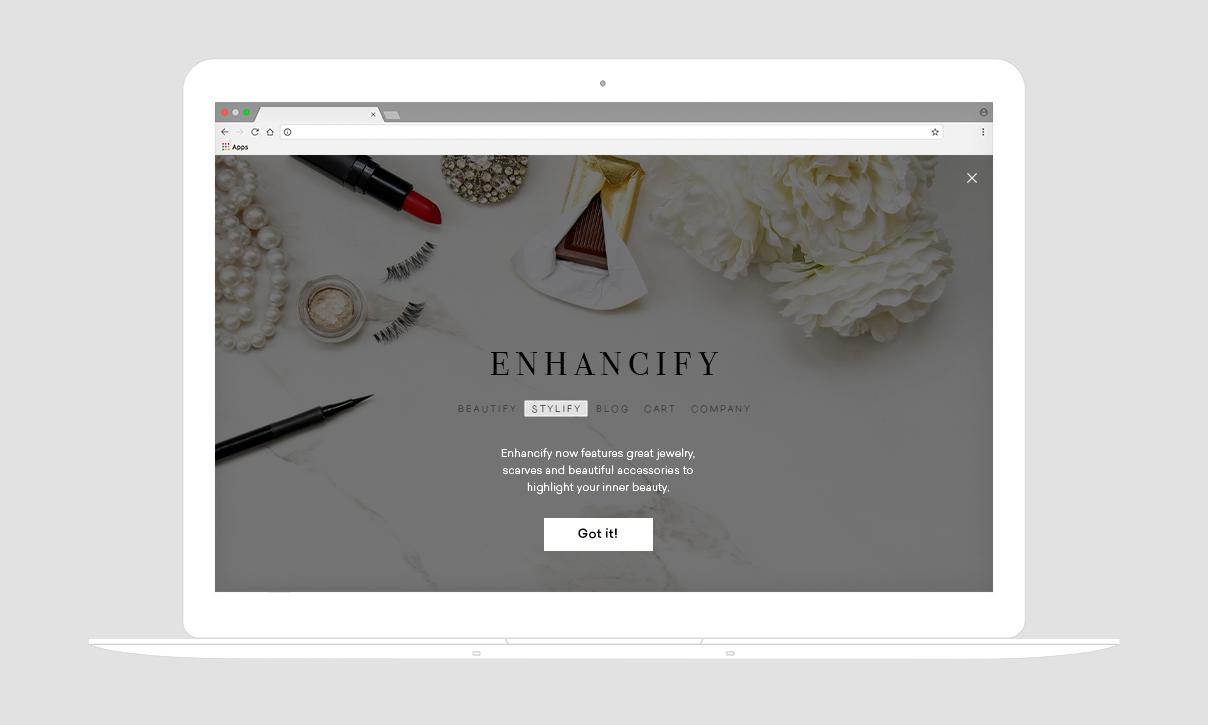 A laptop screen displaying a website called "Enhancify," featuring beauty products and accessories. The page includes a call-to-action button that says "Got it!
