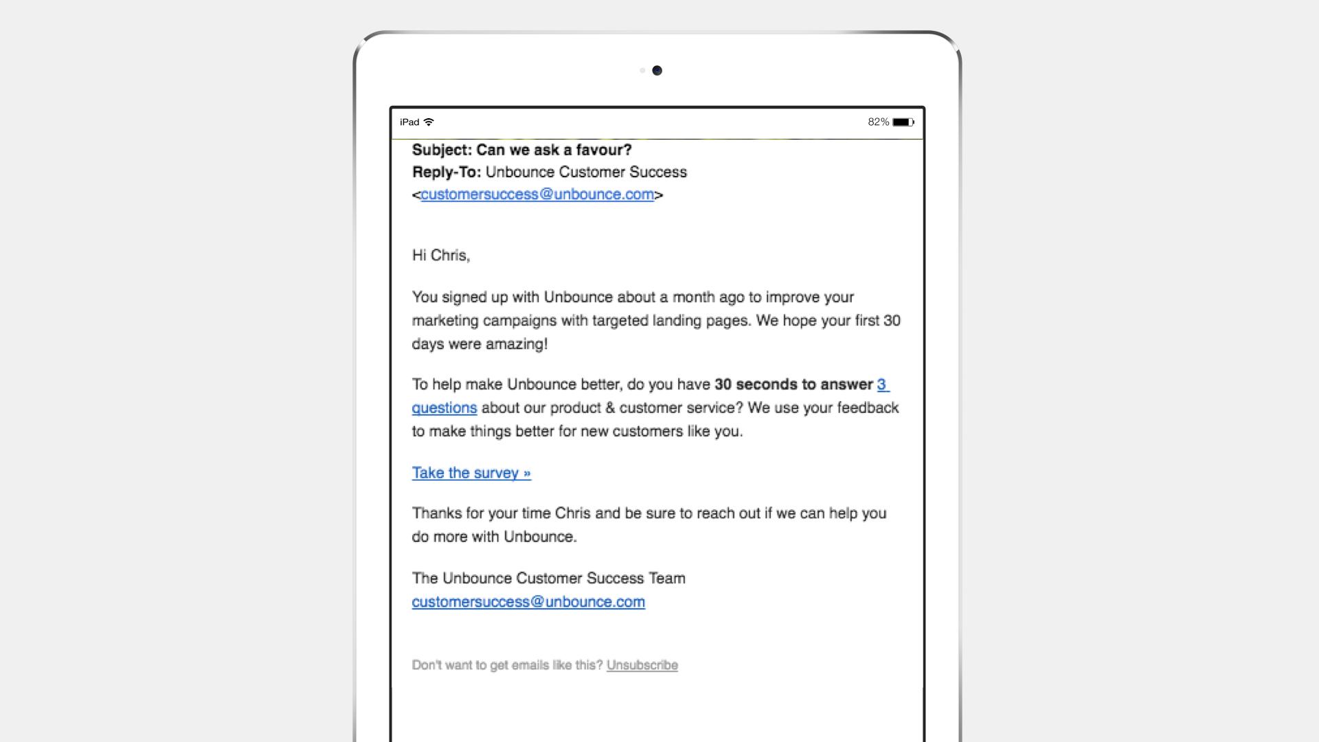 An email on an iPad screen from Unbounce Customer Success, asking for feedback on marketing campaigns and offering a survey link. The subject line reads, "Can we ask a favor?