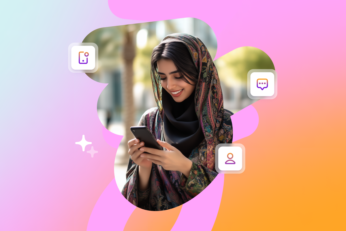 a woman wearing a hijab is looking at her phone