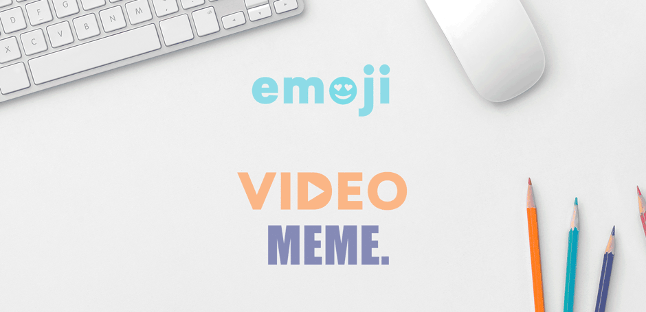 emoji video meme is written on a white surface next to a keyboard and mouse representing gif vs meme