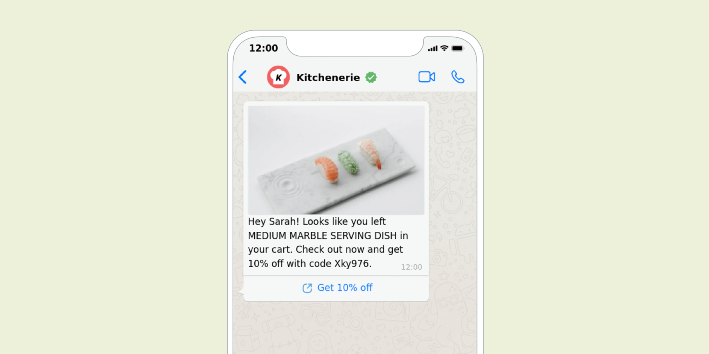 A smartphone screen displaying a message about a medium marble serving dish left in a shopping cart, with a promotional code for a discount.