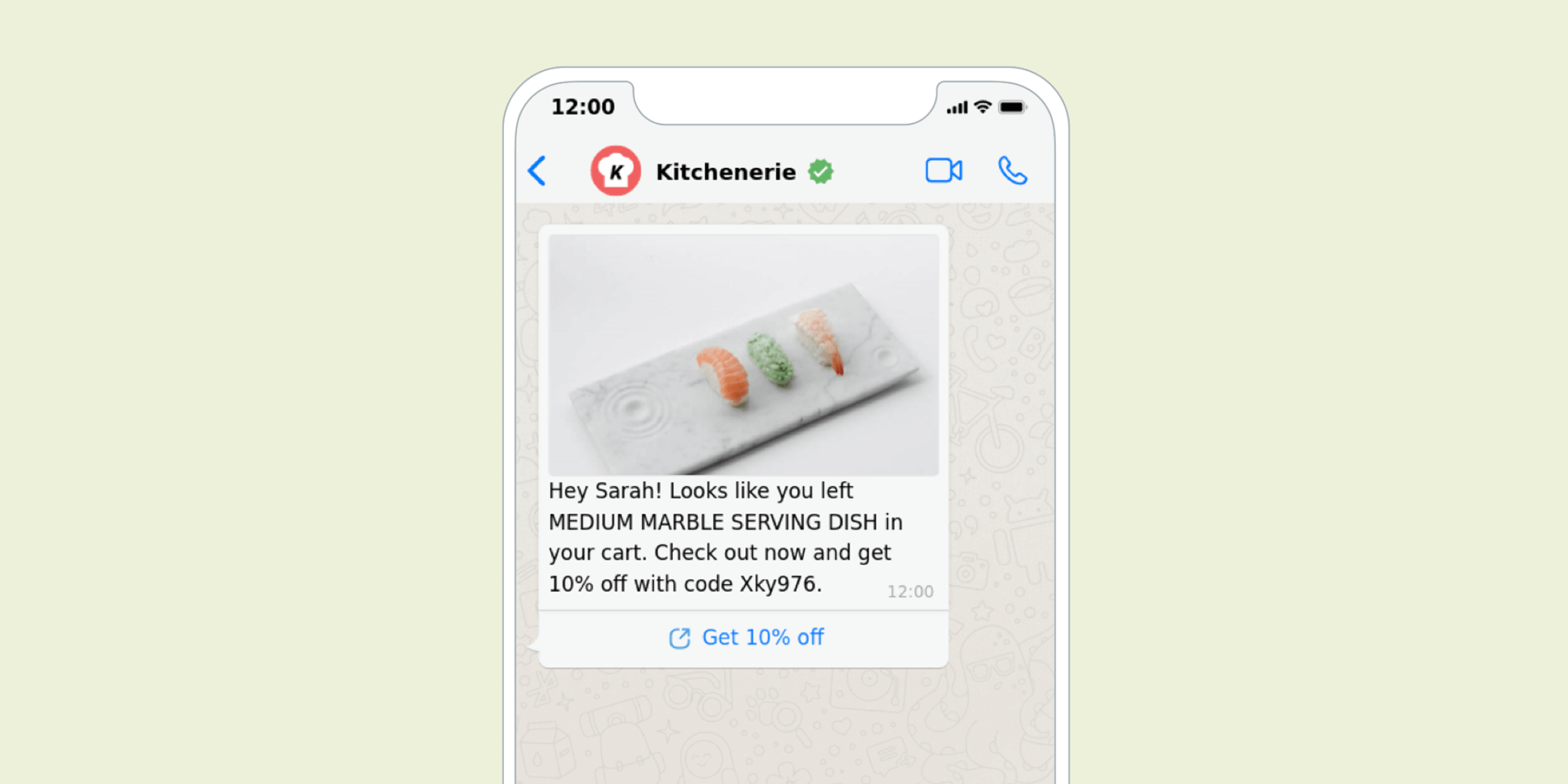 A smartphone screen displaying a message about a medium marble serving dish left in a shopping cart, with a promotional code for a discount.