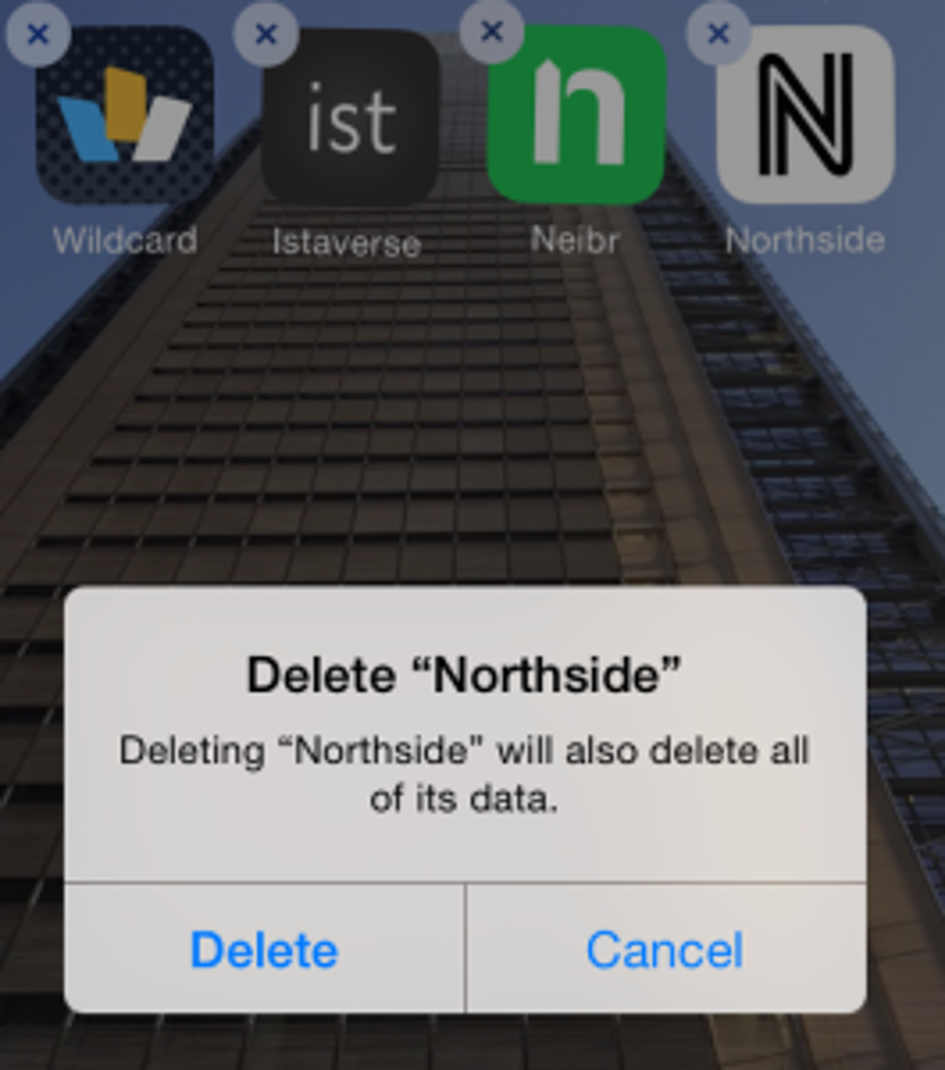 A confirmation dialog box appears on a smartphone screen, asking to delete the app "Northside" and warning that all its data will also be deleted. Options to "Delete" or "Cancel" are provided.