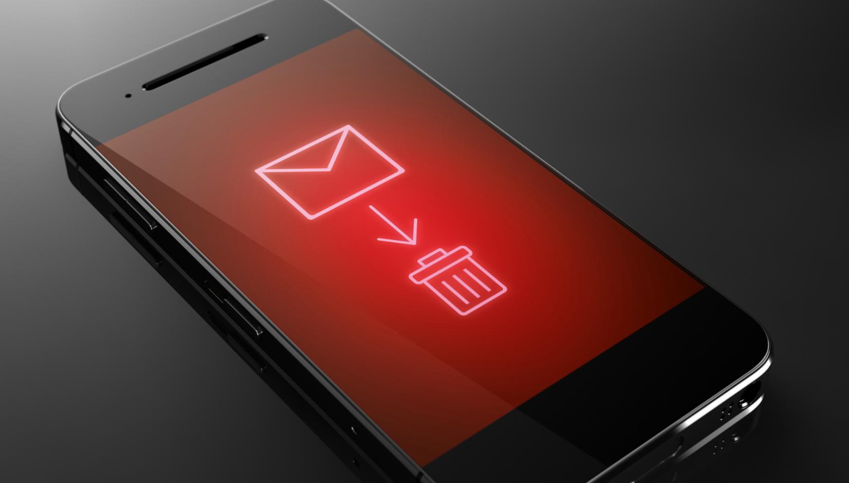 A smartphone screen displaying an email icon with an arrow pointing to a trash can icon, set against a red background.