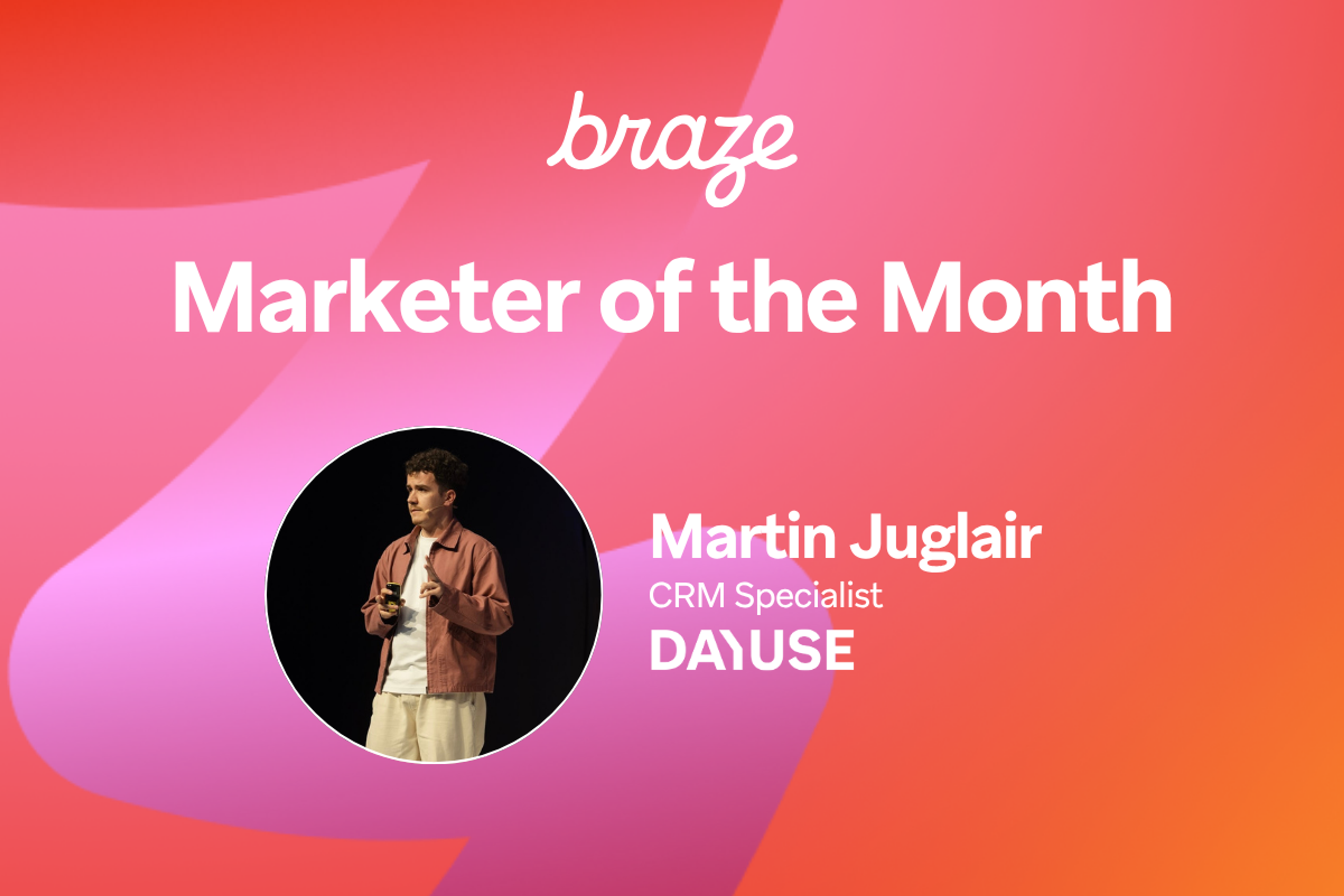 Braze Marketer of the Month: Martin Juglair, CRM Specialist at DAIUSE, pictured speaking onstage.