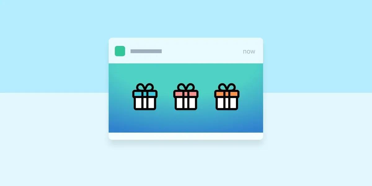 Ilustração de um cartão de notificação com três ícones de caixa de presente: azul, rosa e laranja.