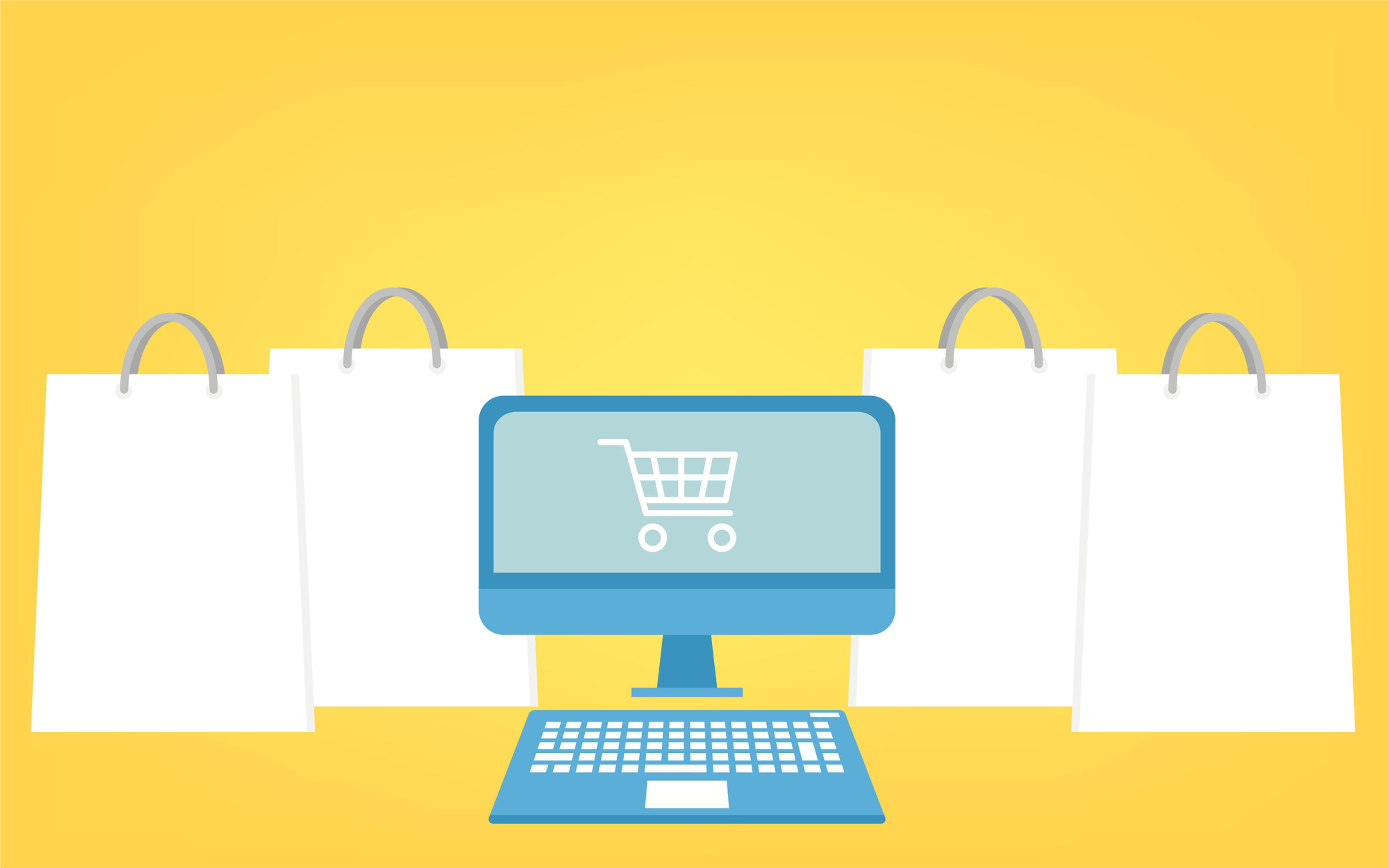 a computer with a shopping cart on the screen is surrounded by shopping bags .