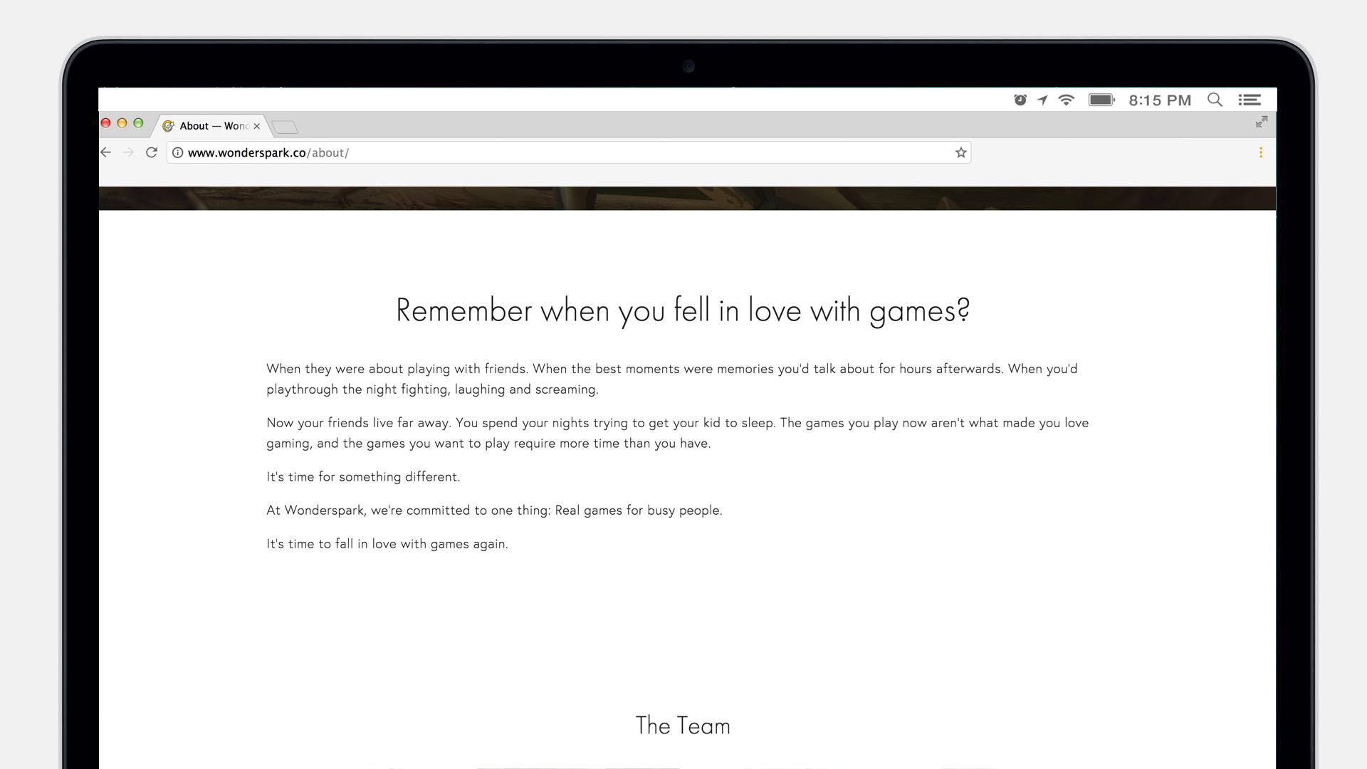 A laptop screen displaying a webpage titled "About" with text reflecting on the joy of playing games and the team's commitment to creating real experiences for players.