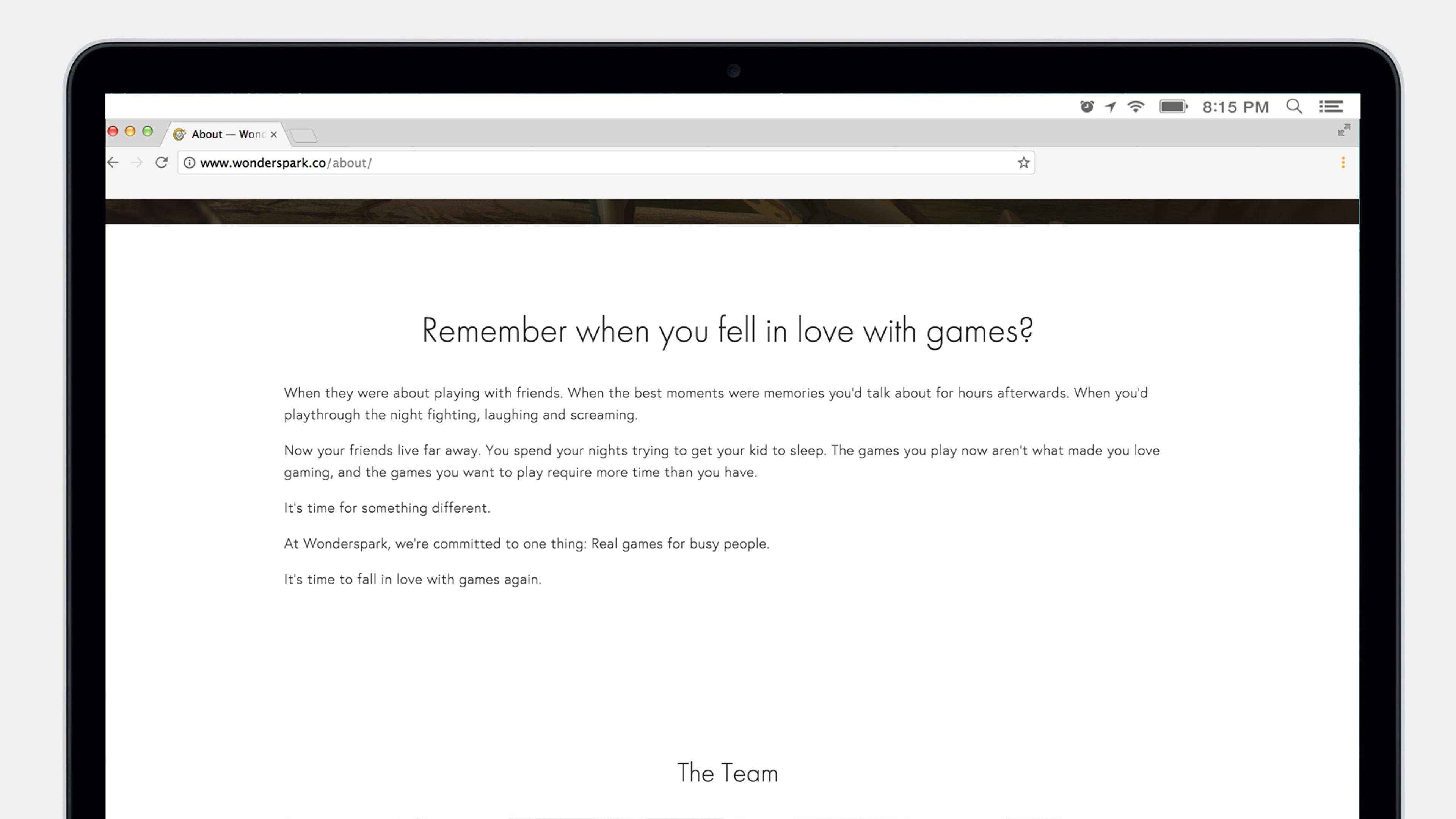 A laptop screen displaying a webpage titled "About" with text reflecting on the joy of playing games and the team's commitment to creating real experiences for players.