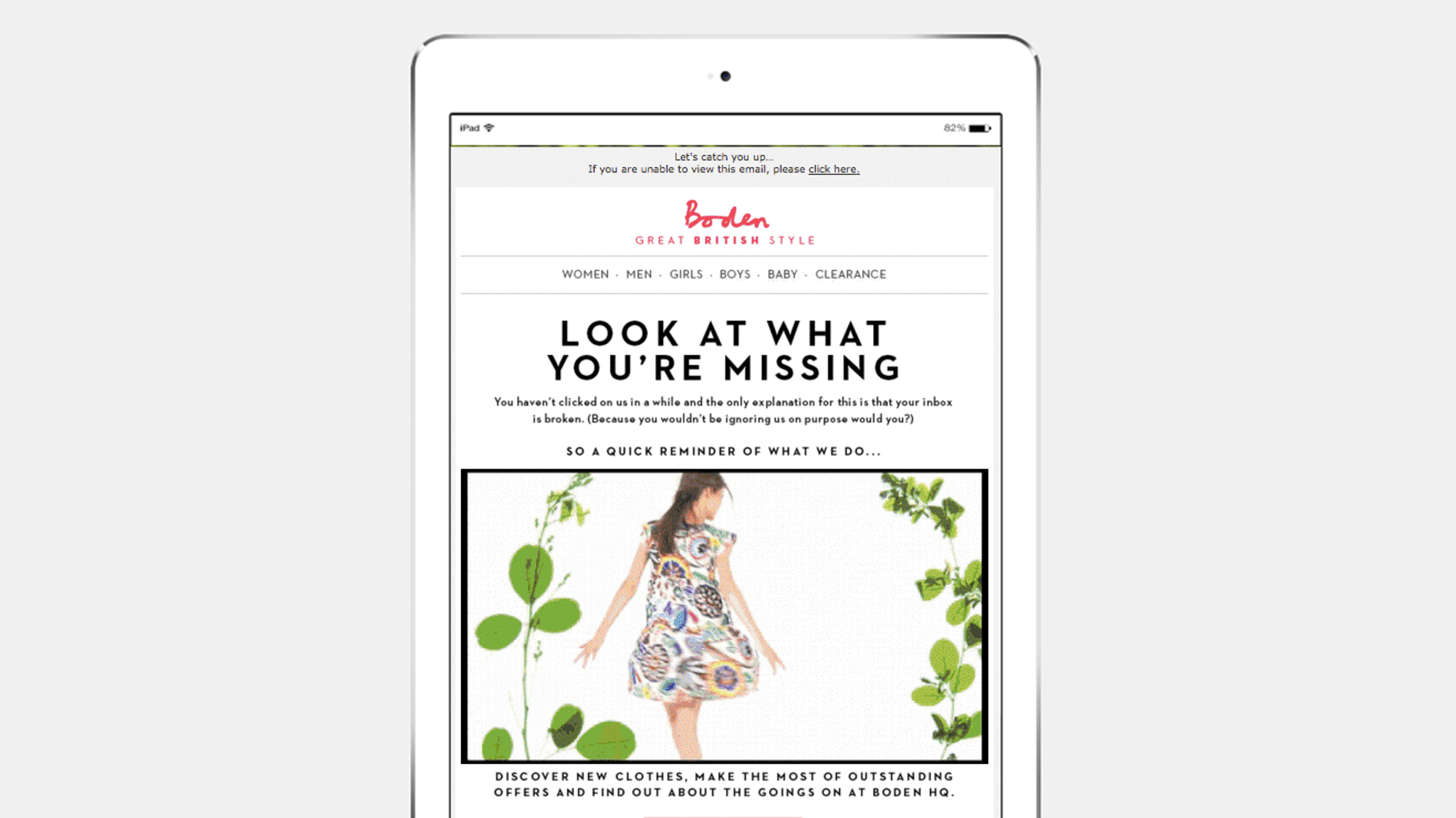 A tablet displaying a fashion email from Boden, featuring a model in a floral dress and text highlighting new clothing offers.