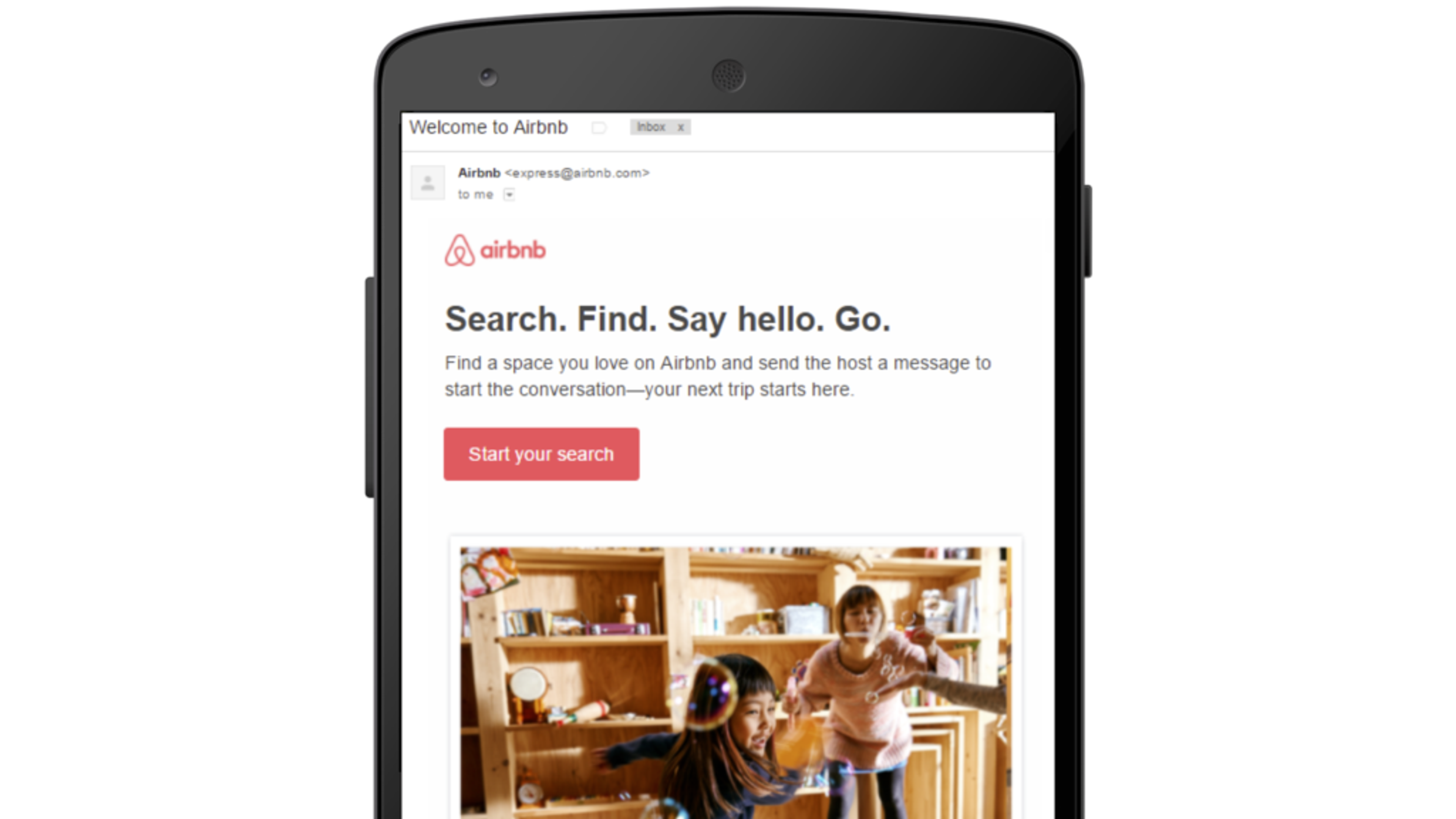 A mobile screen displaying an Airbnb welcome message with a search prompt and two children playing in a wooden play area.