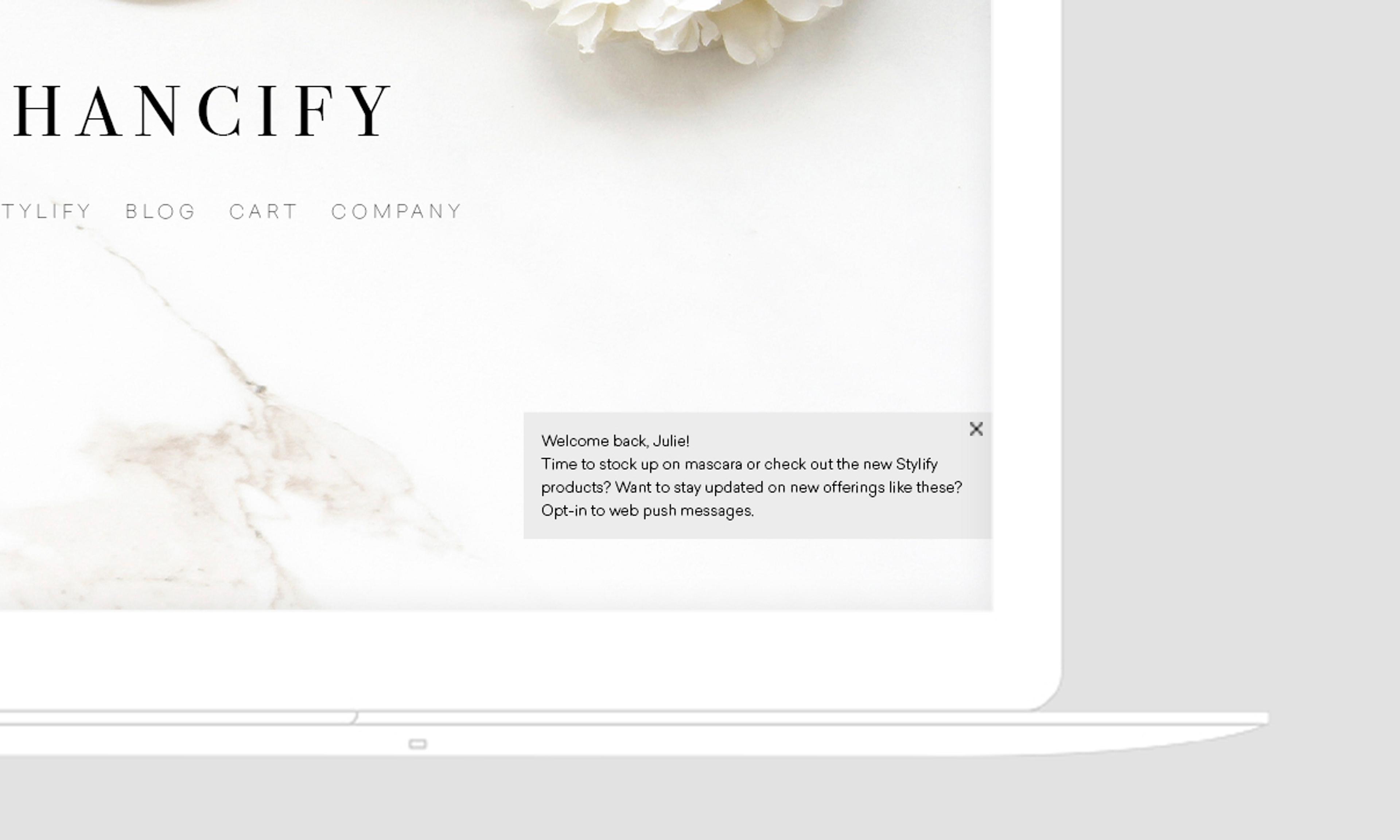 A welcome message on a website, addressing a user named Julie and prompting her to opt-in for web push messages about new products. The background features a marble texture with a floral element.