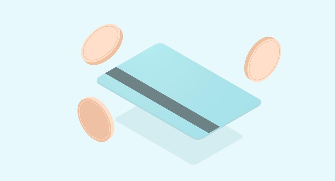 A light blue credit card surrounded by two coins on a pale background. The card has a dark stripe across the middle.