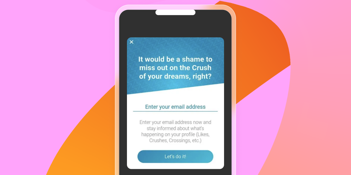 A smartphone displays a dating app pop-up urging email signup to receive updates on crushes and profile activity.