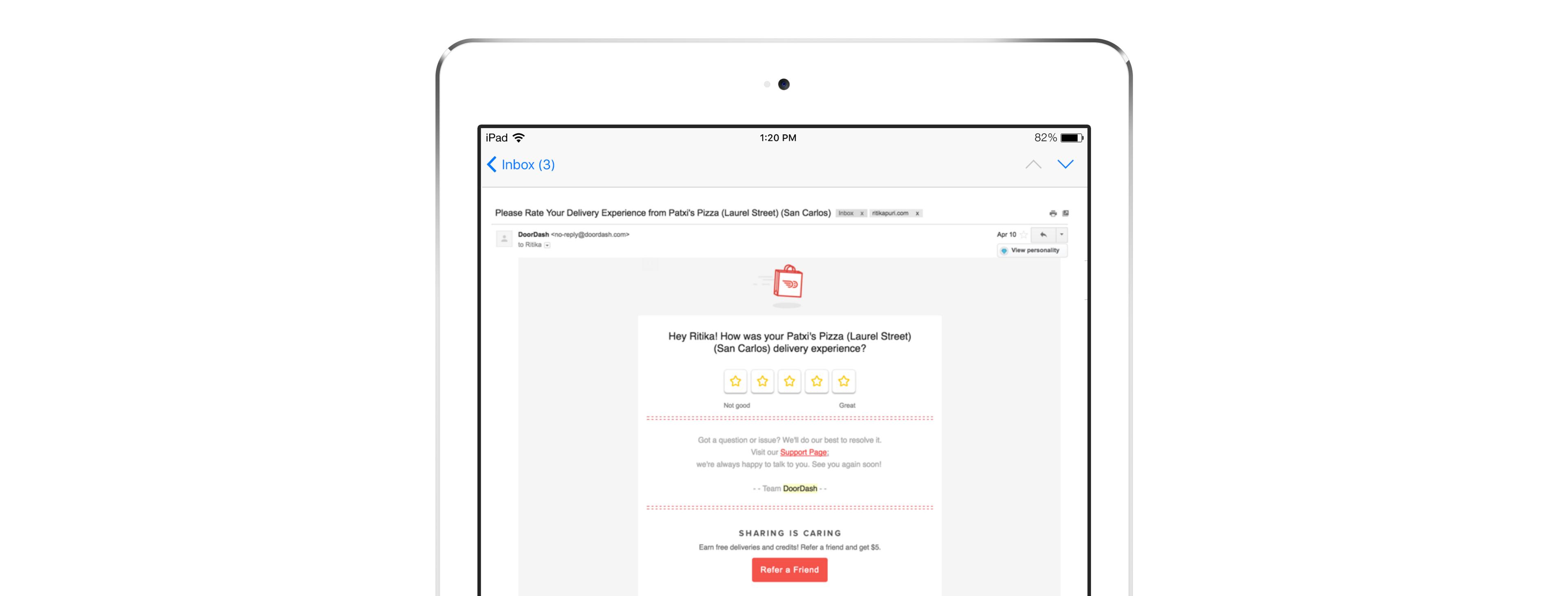An email on a tablet screen requesting feedback with a rating system and a button to submit. The email includes a header and a brief message.
