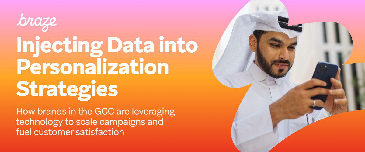 a man is looking at his phone with the words braze injecting data into personalization strategies