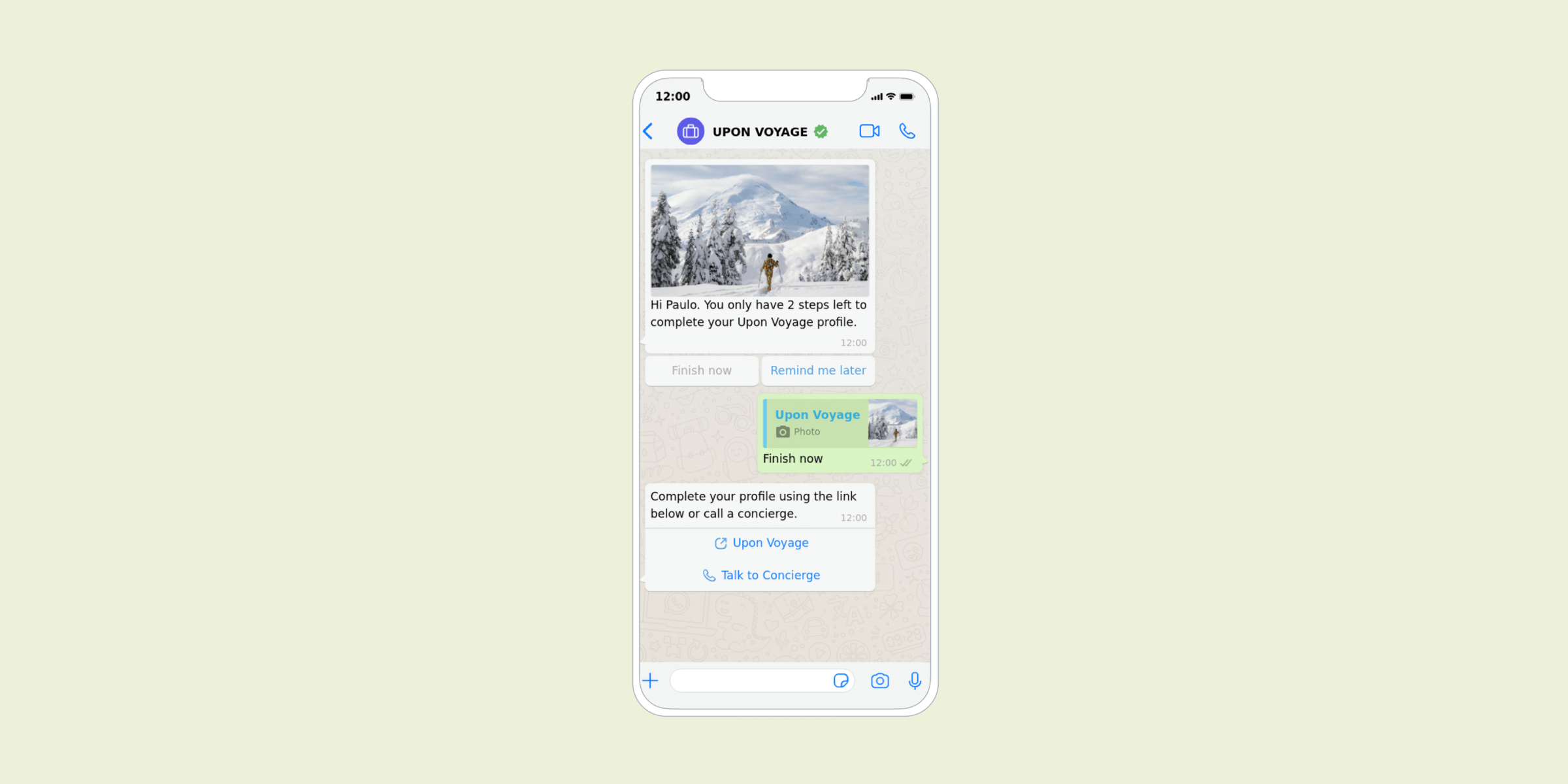 A smartphone screen displaying a WhatsApp conversation with a snowy mountain image and a message prompting the user to complete their profile on "Upon Voyage.