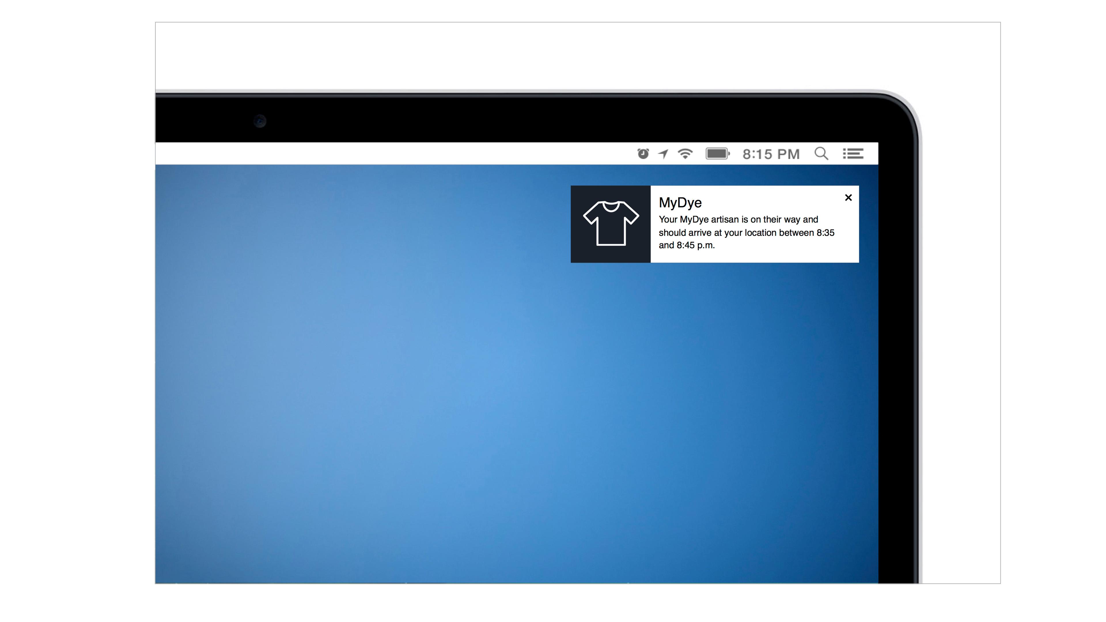 A notification on a laptop screen indicates that a MyDye shirt is on the way and will arrive at the location between 8:15 and 8:45 PM.