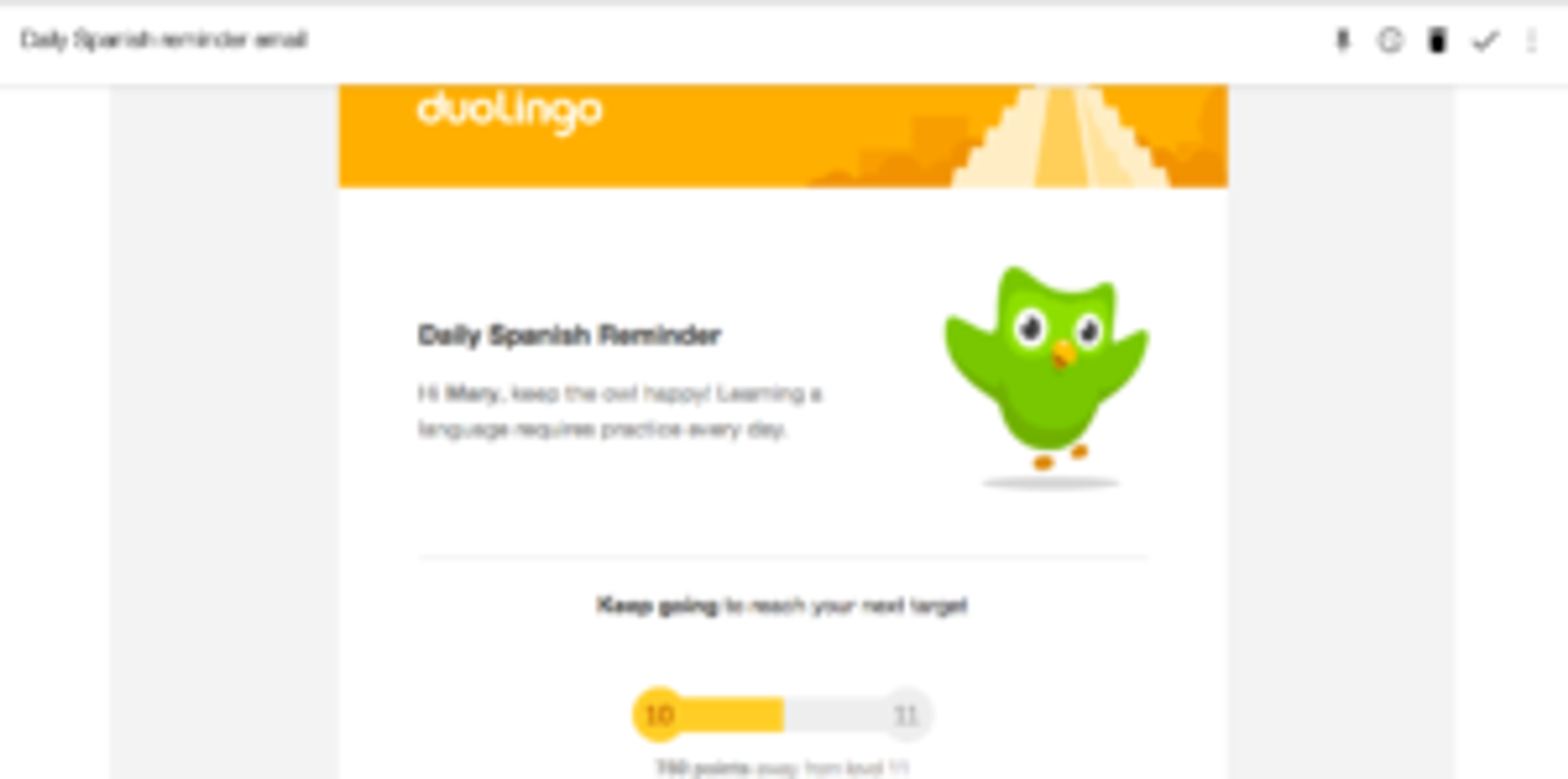 A reminder email from Duolingo encouraging daily Spanish practice, featuring a green owl mascot and a progress bar.