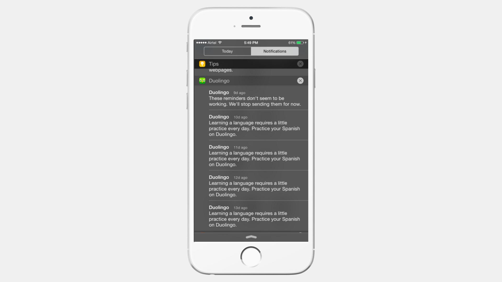 A smartphone displaying notifications from the Duolingo app, including reminders to practice Spanish daily.