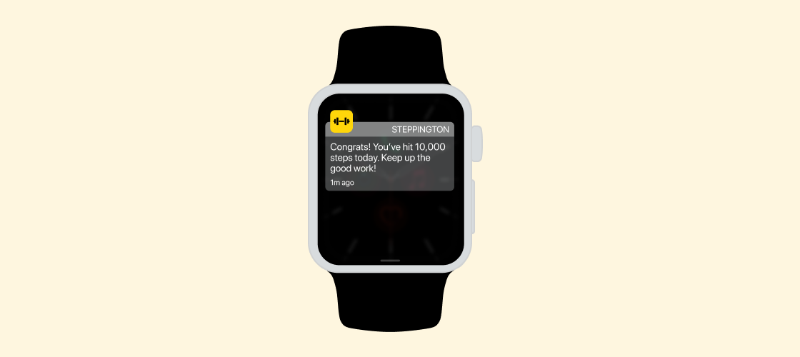 A smartwatch displays a notification congratulating the user for reaching 10,000 steps today, encouraging them to keep up the good work.