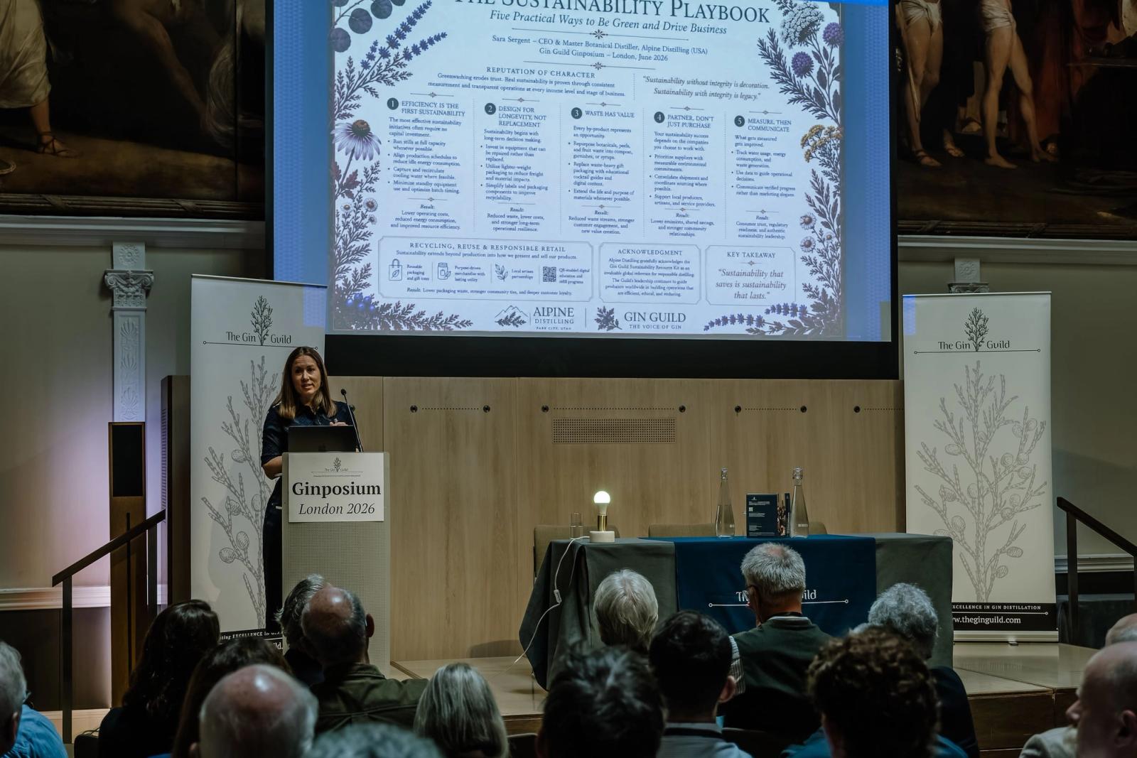 Ginposium London 2026: a speaker presents The Sustainability Playbook.