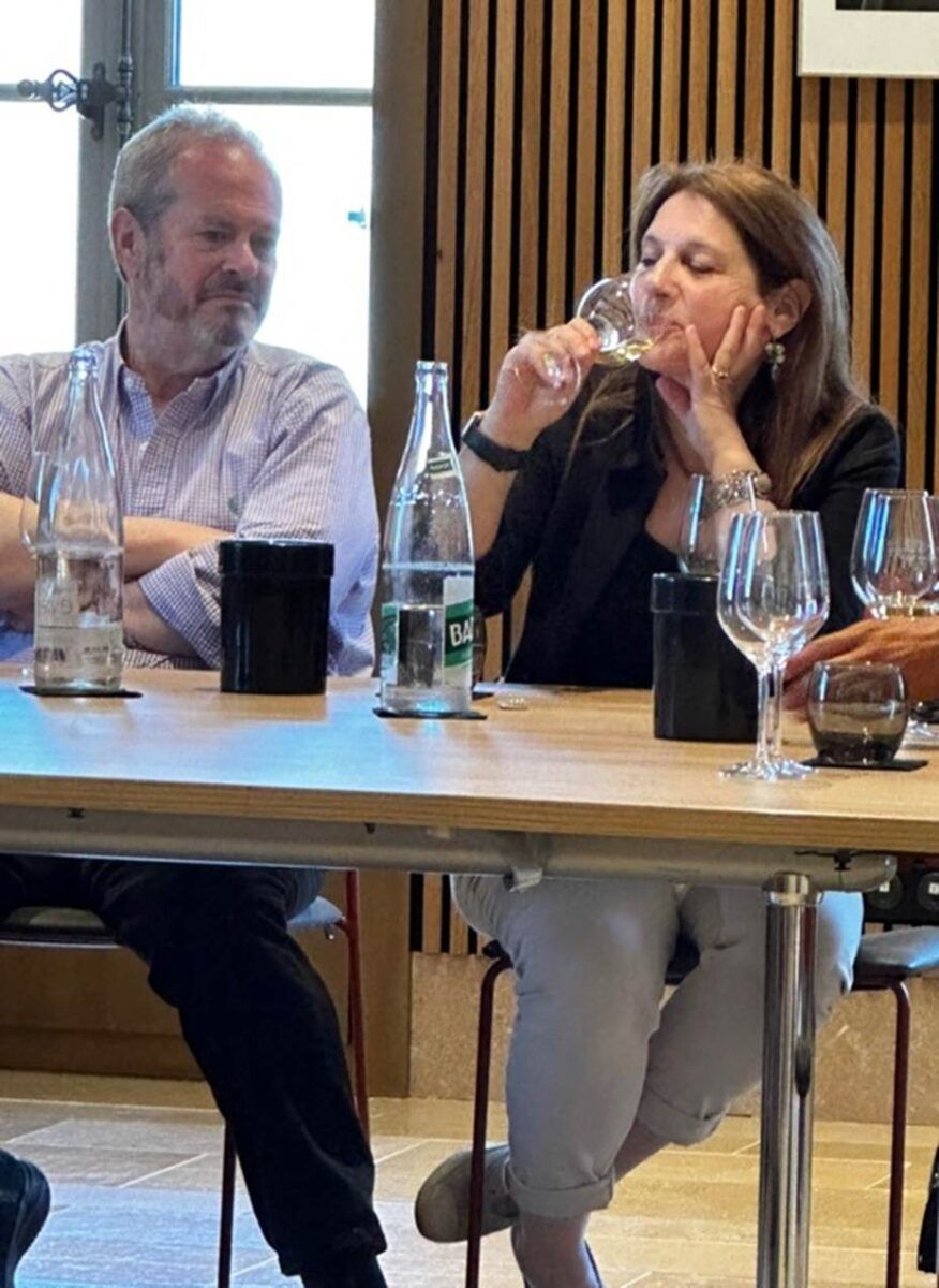 Two people tasting wine at a table in Les Halles