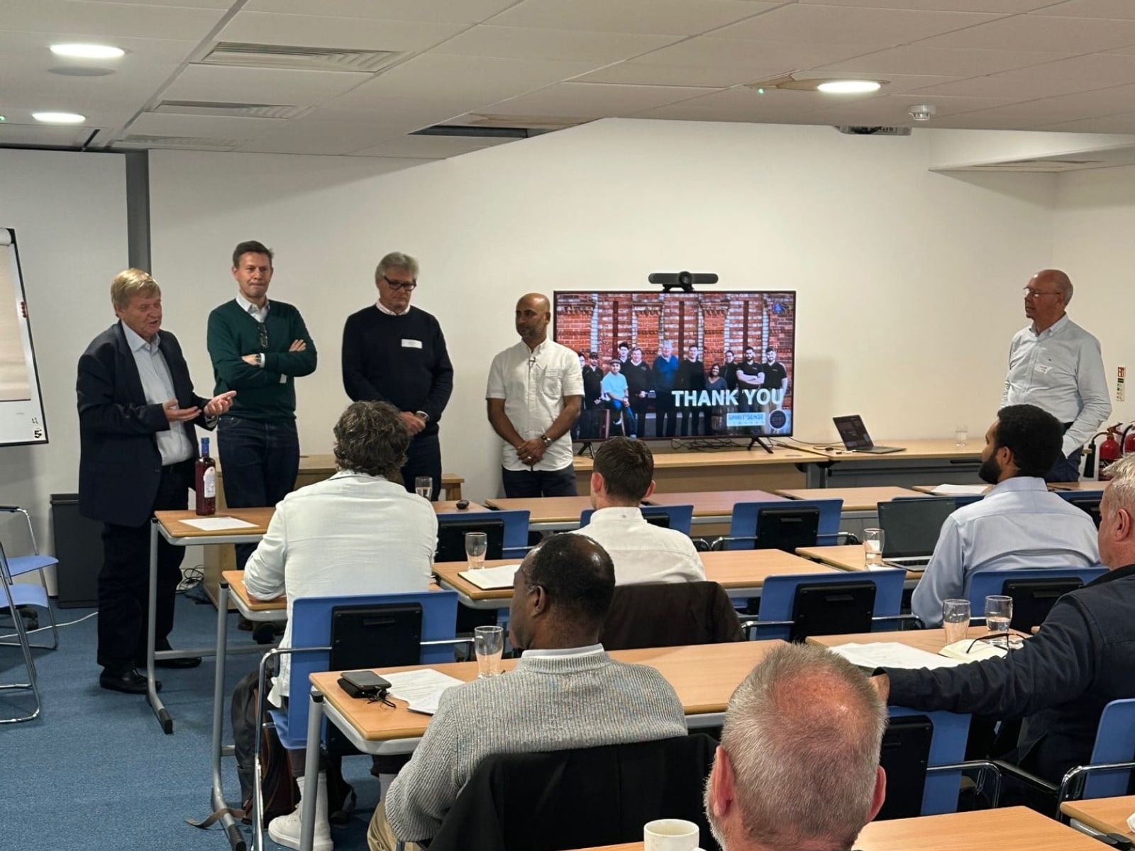 Speakers addressing students in a spirits education classroom seminar.