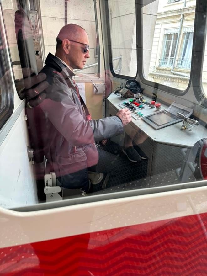A funicular driver at the controls